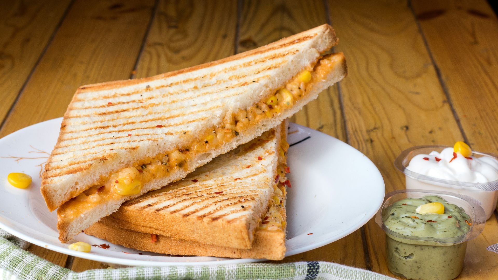 bread with cheese fillings on white ceramic plate