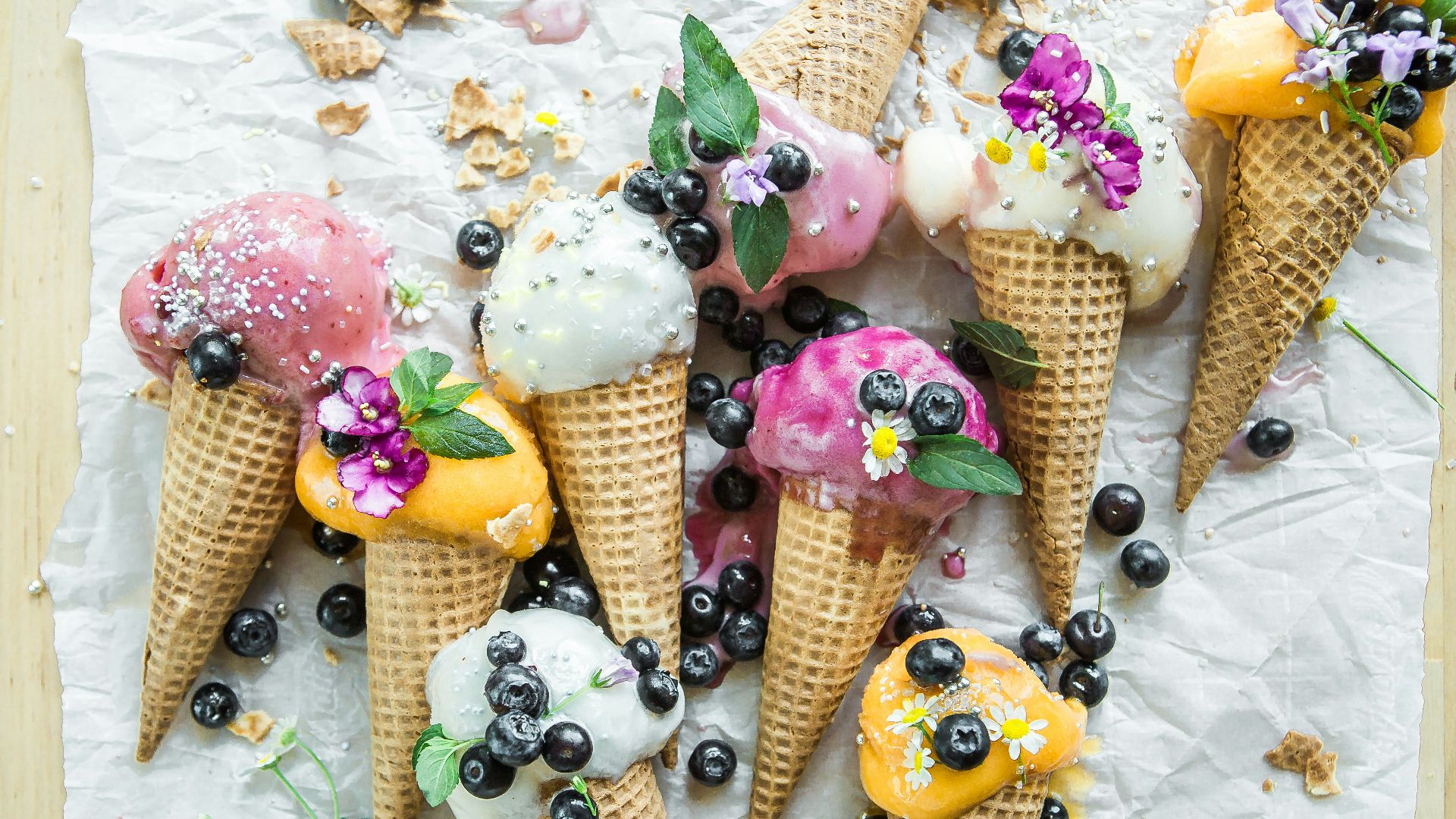 coned ice cream with blueberries and flowers