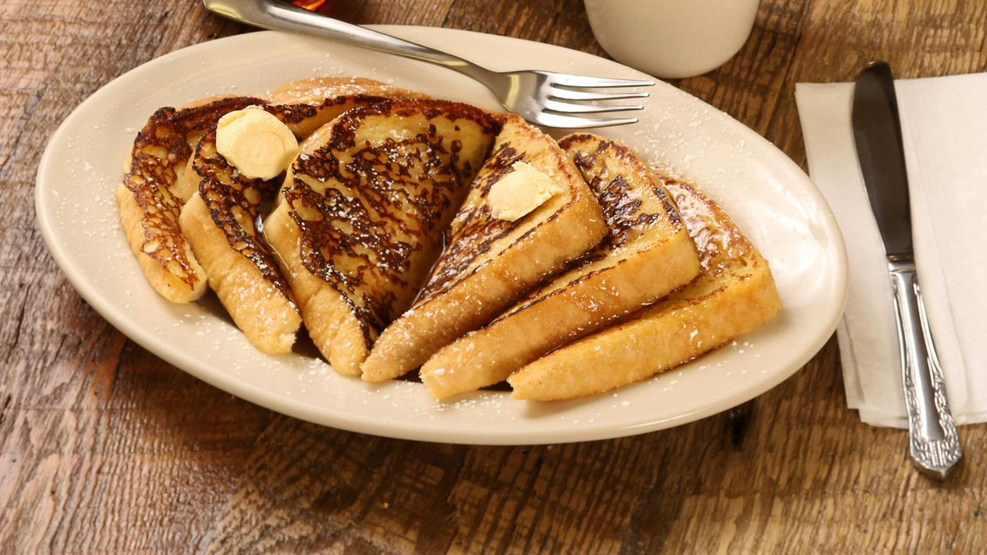 food photography of strawberries, oranges, and pancakes on plates