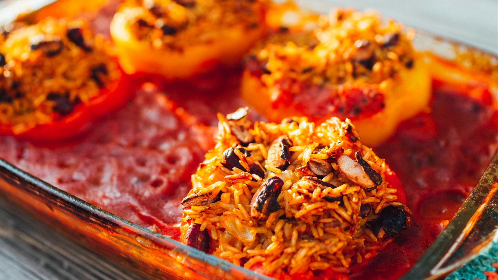 brown and red dish on brown wooden tray