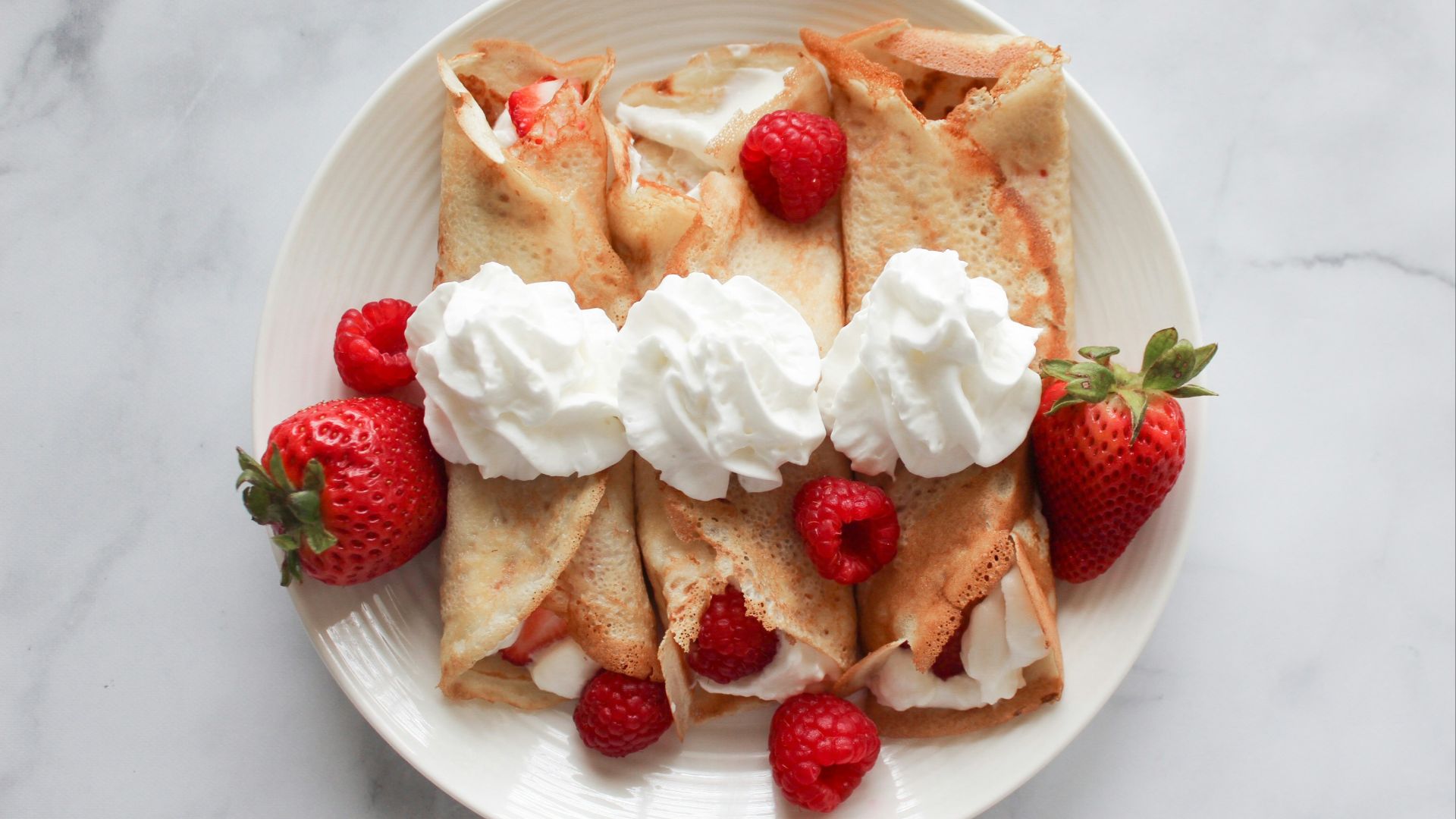 strawberry and banana on white ceramic plate