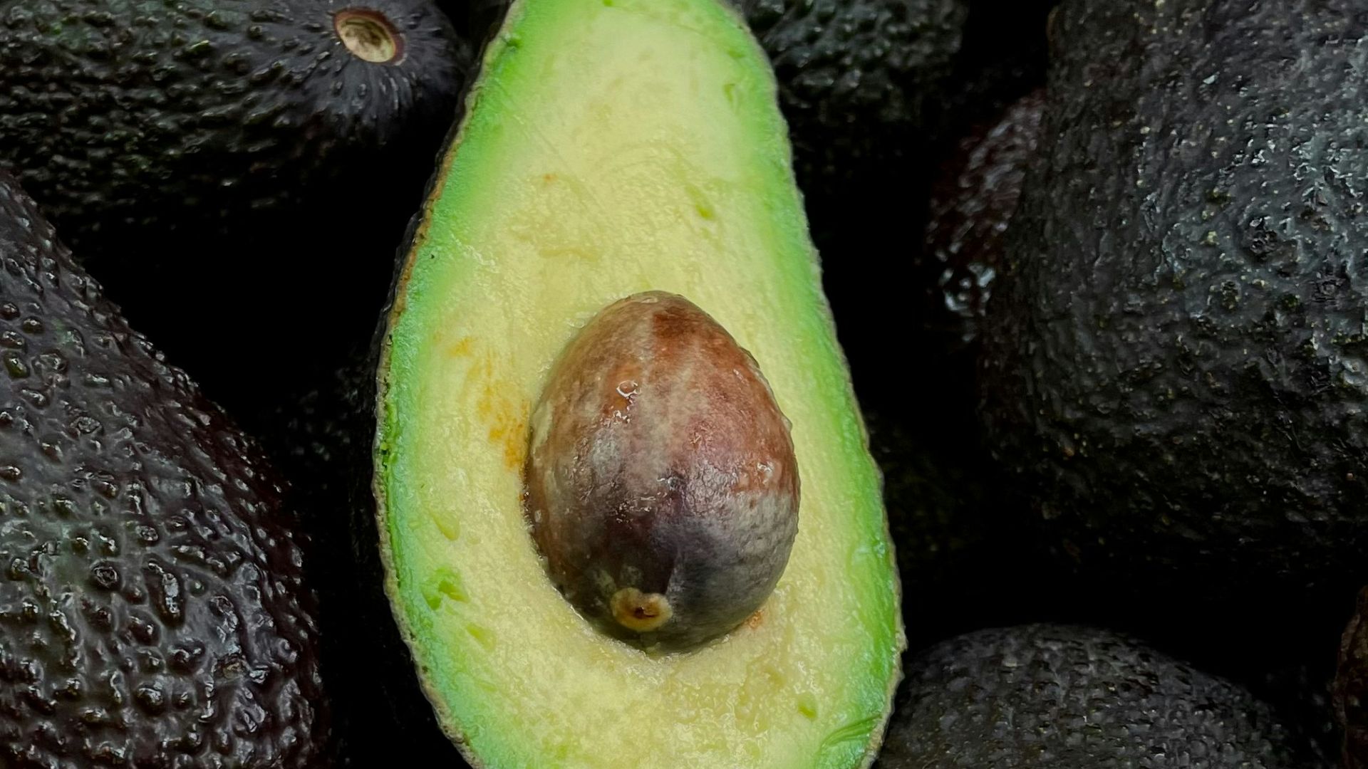 green and brown fruit on black and brown fruits