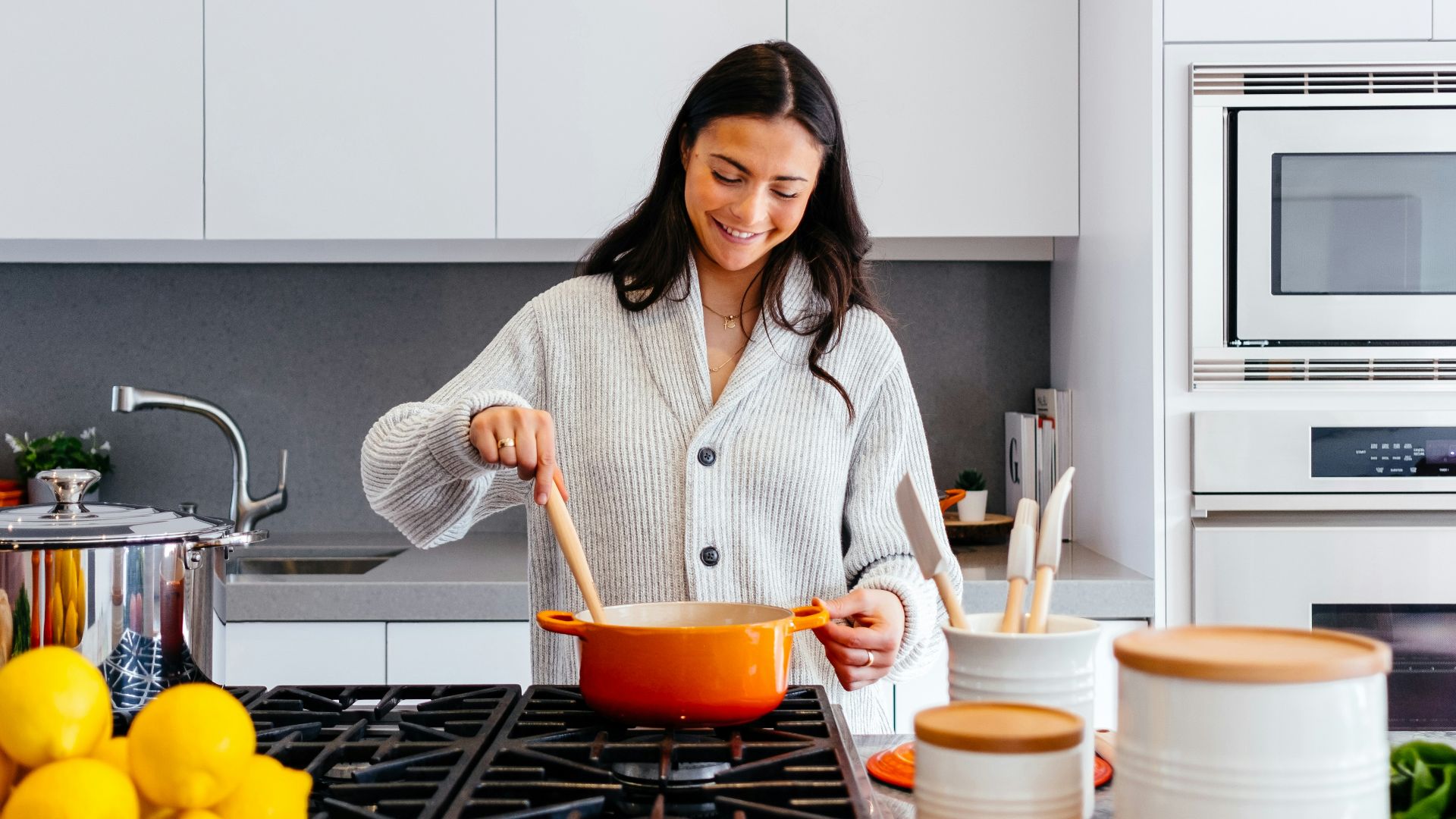 woman cooking inside kitchen room