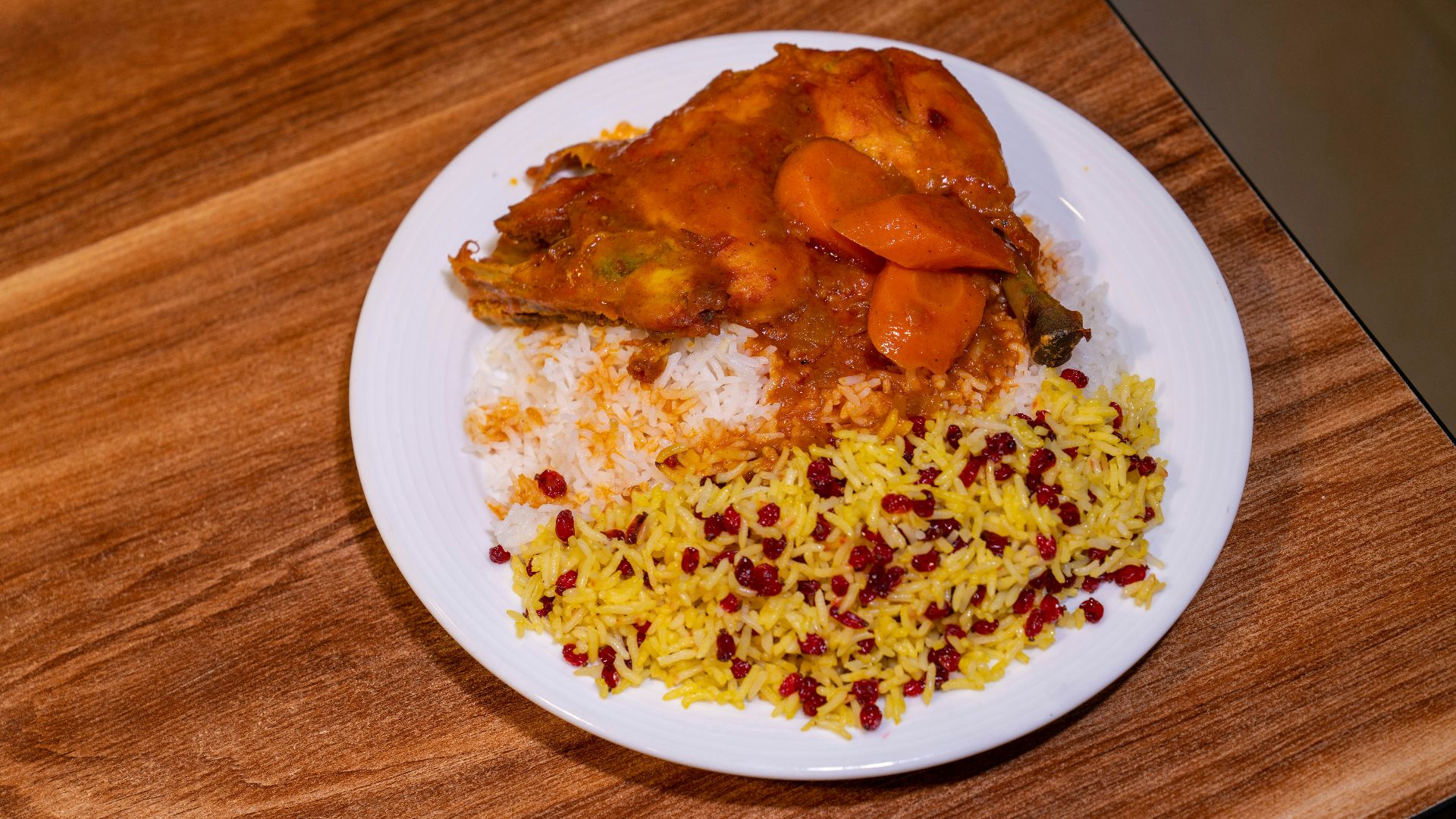 A plate of food on a wooden table