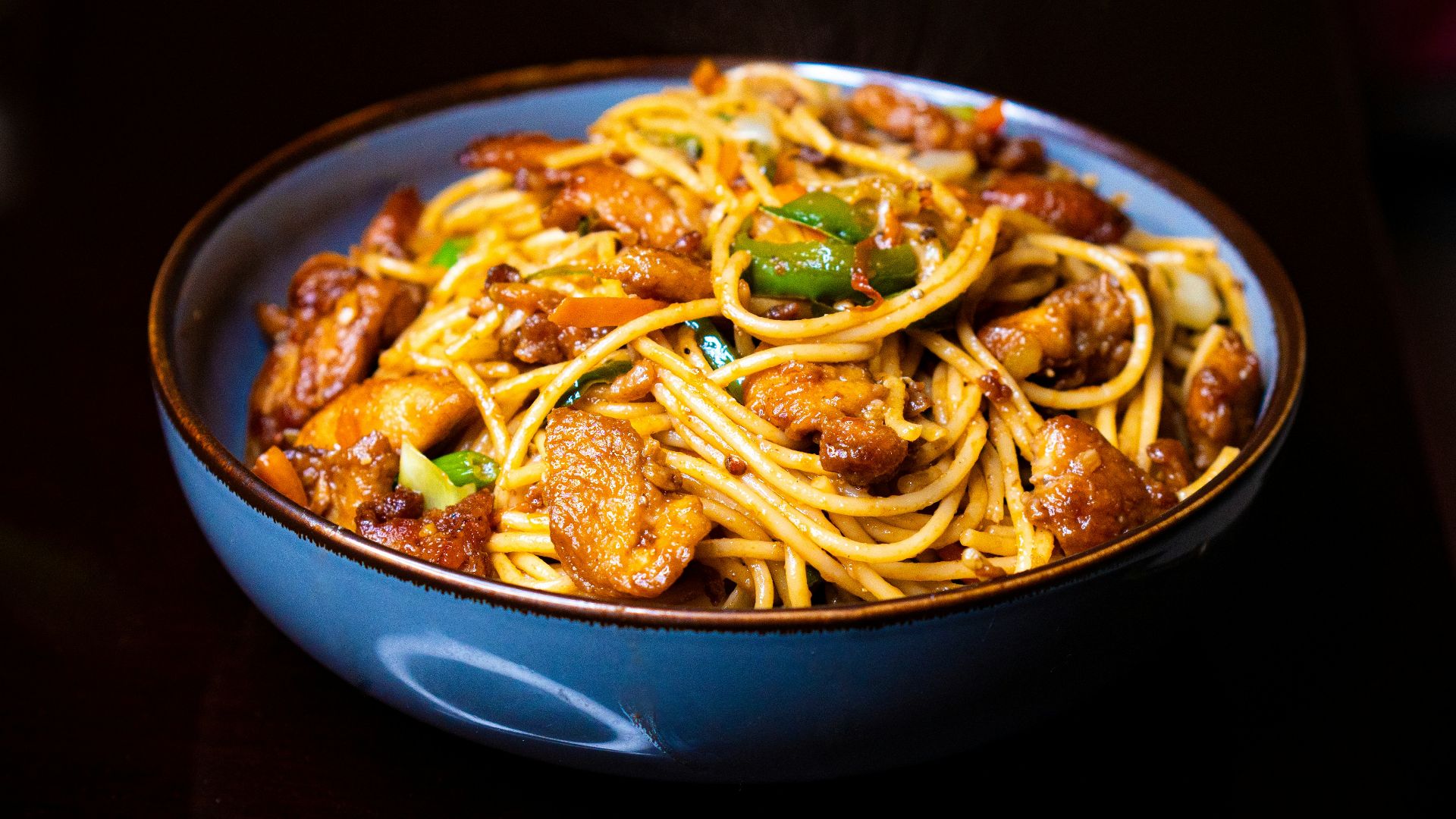 Bowl of spaghetti with meat and vegetables