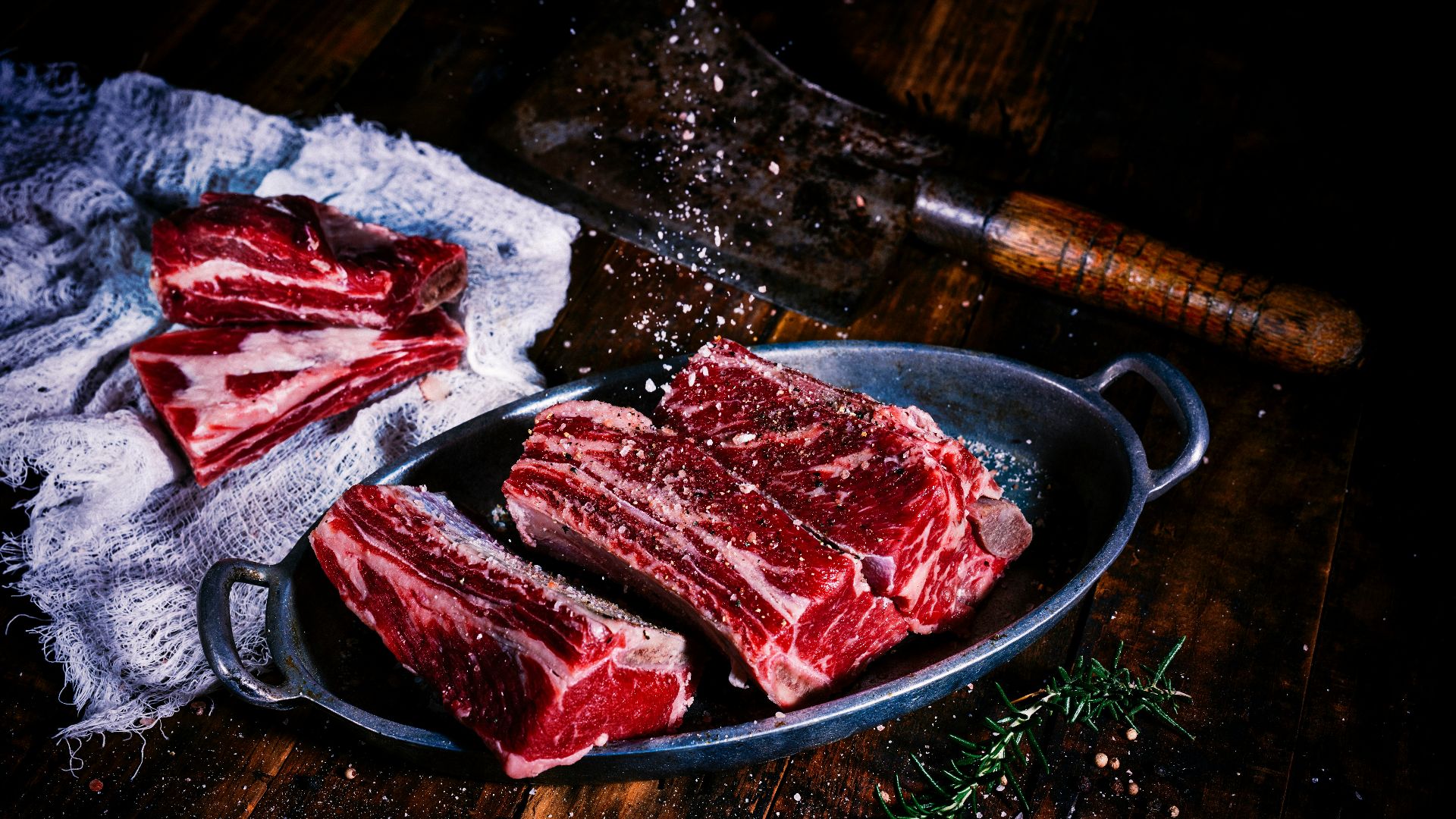sliced meat on black wooden table
