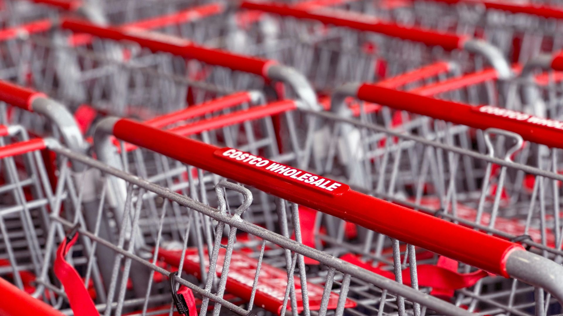 a row of red and silver shopping carts