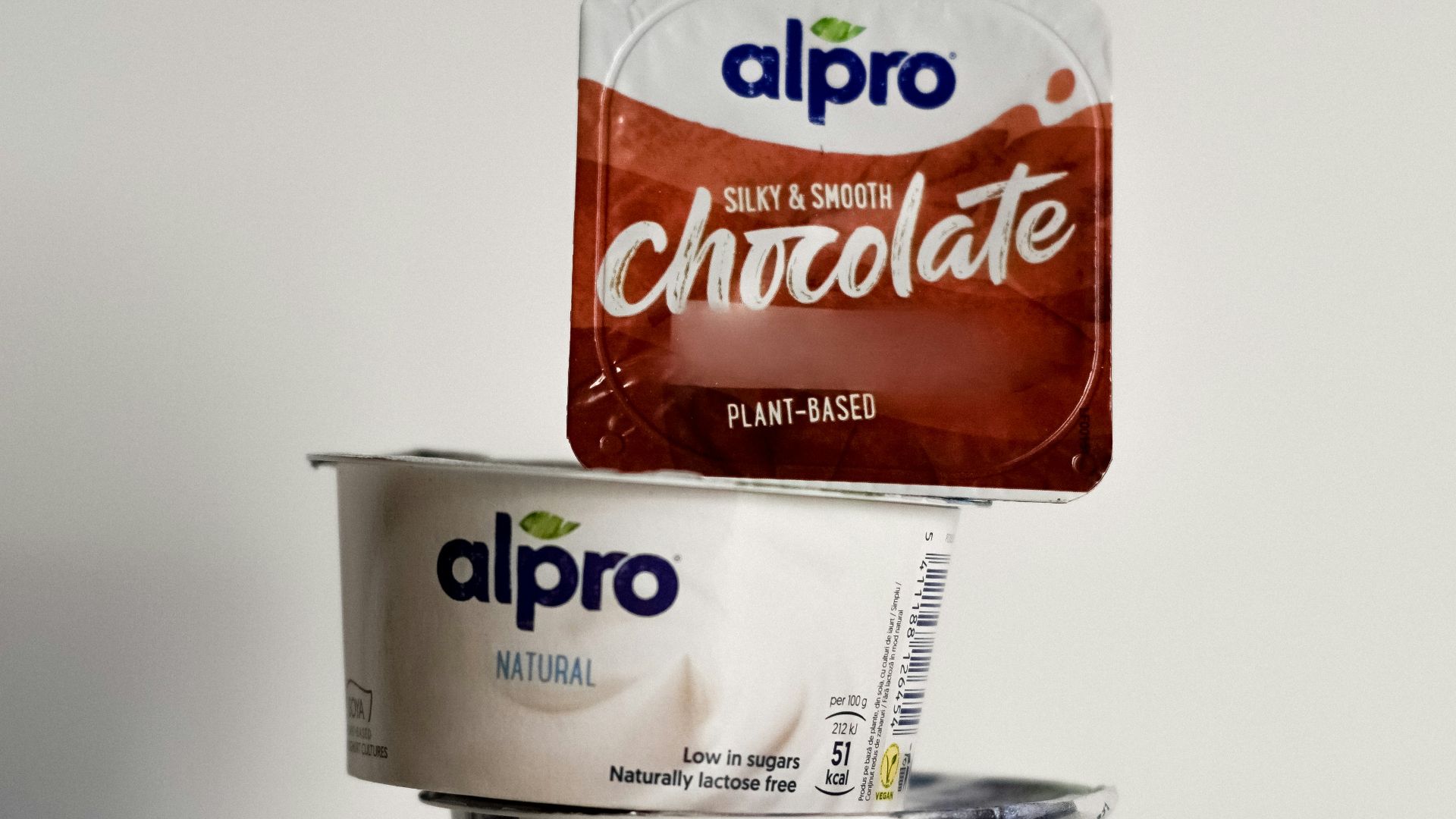 two cups of ice cream and a bag of chocolate