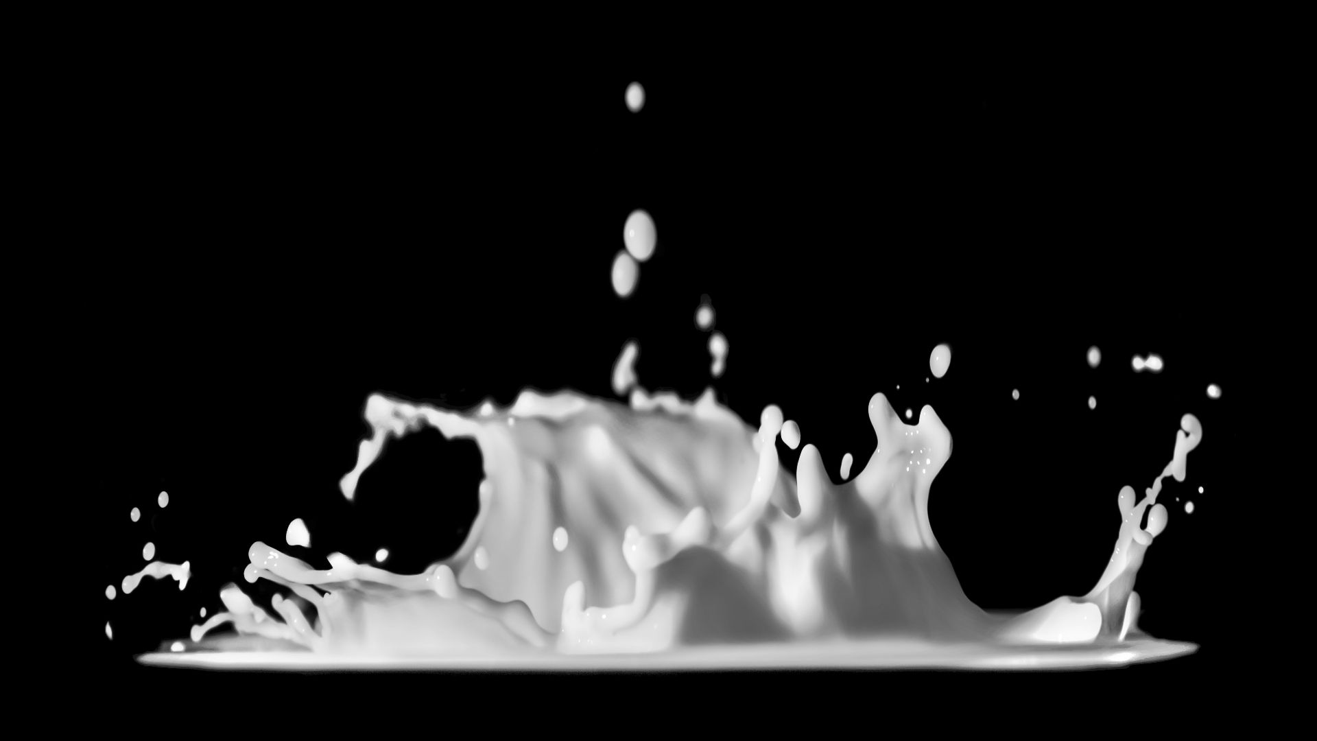 a black and white photo of a liquid splash