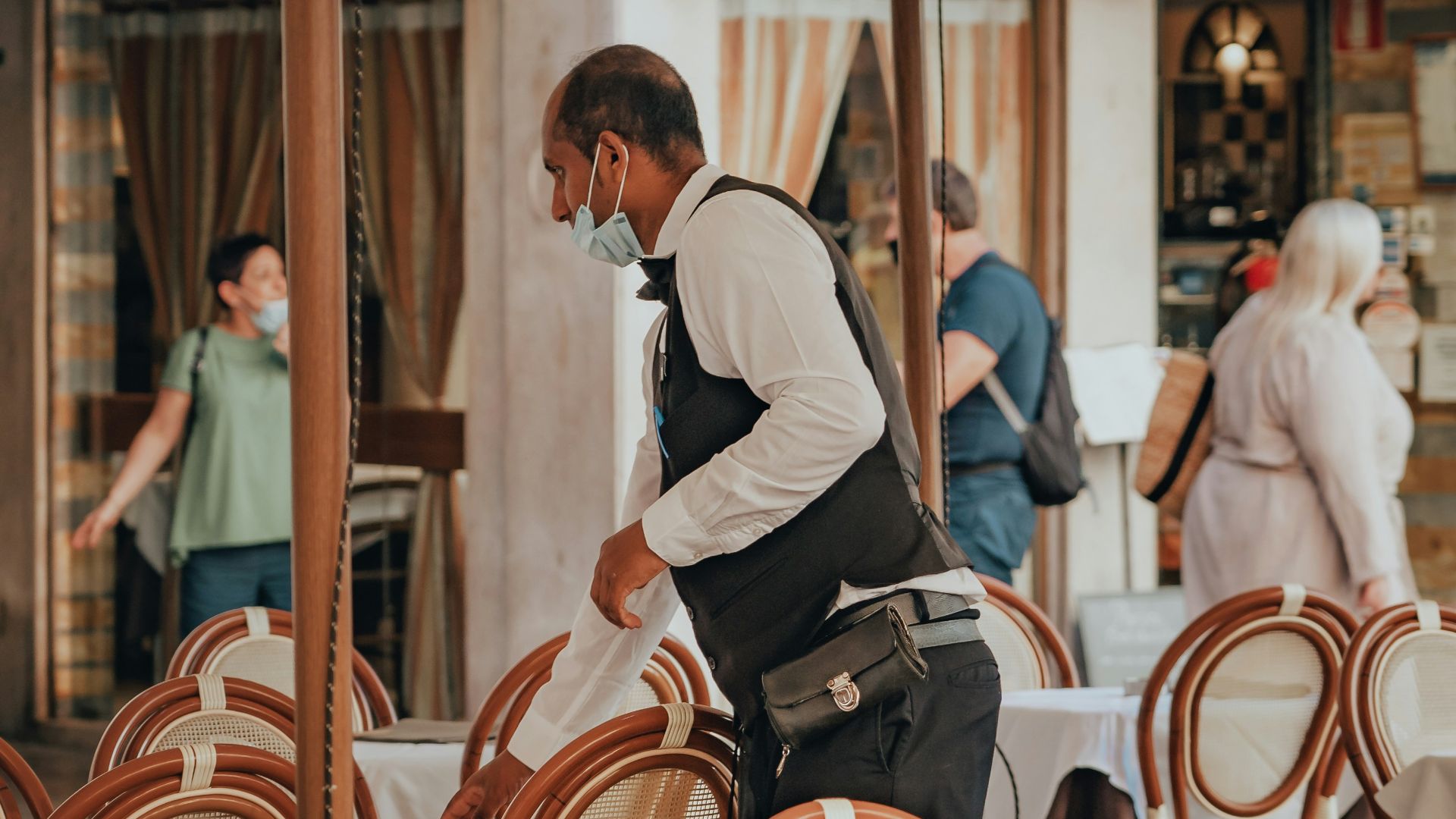 man in white dress shirt sitting on chair