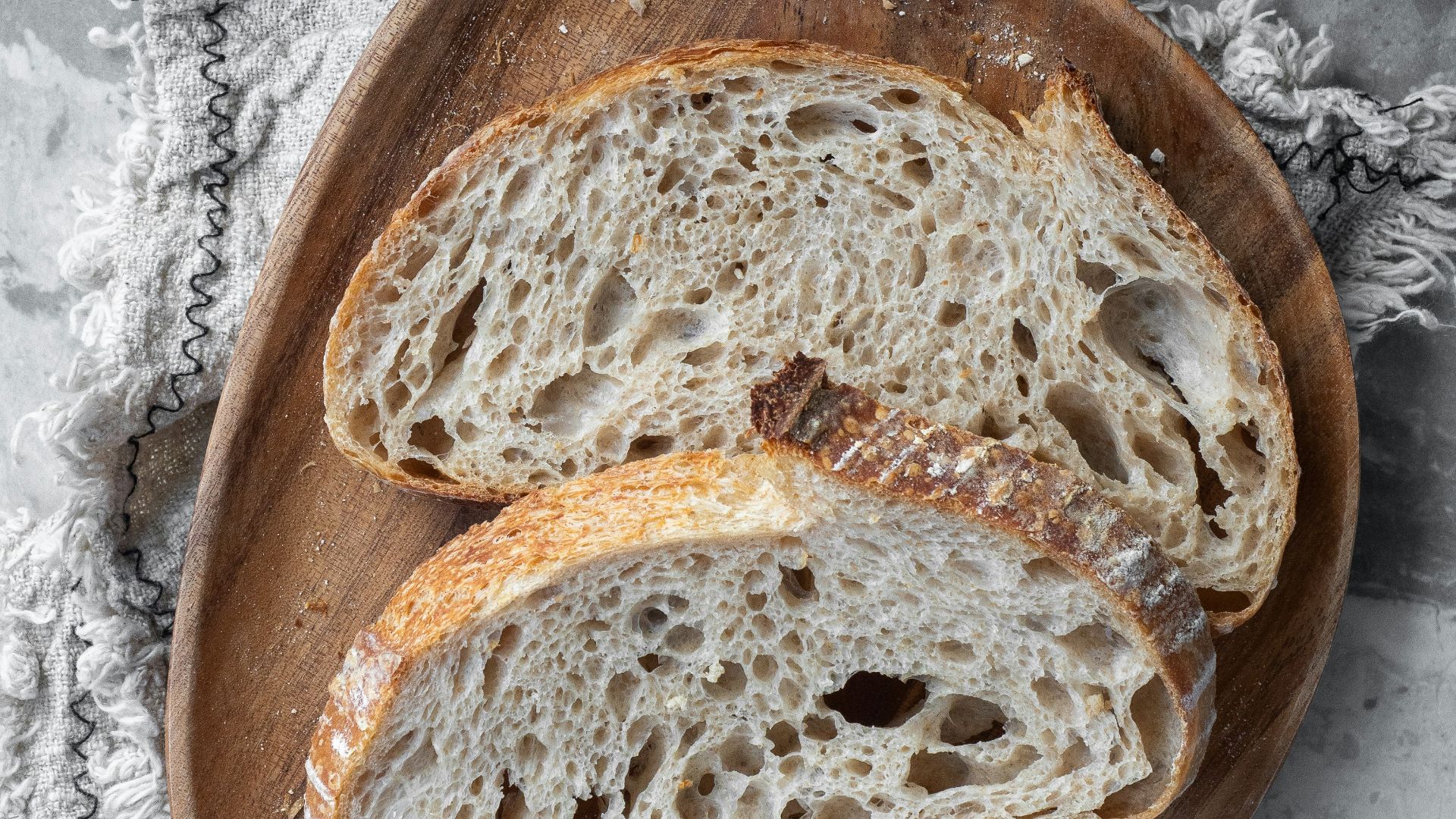 bread on brown wooden round tray