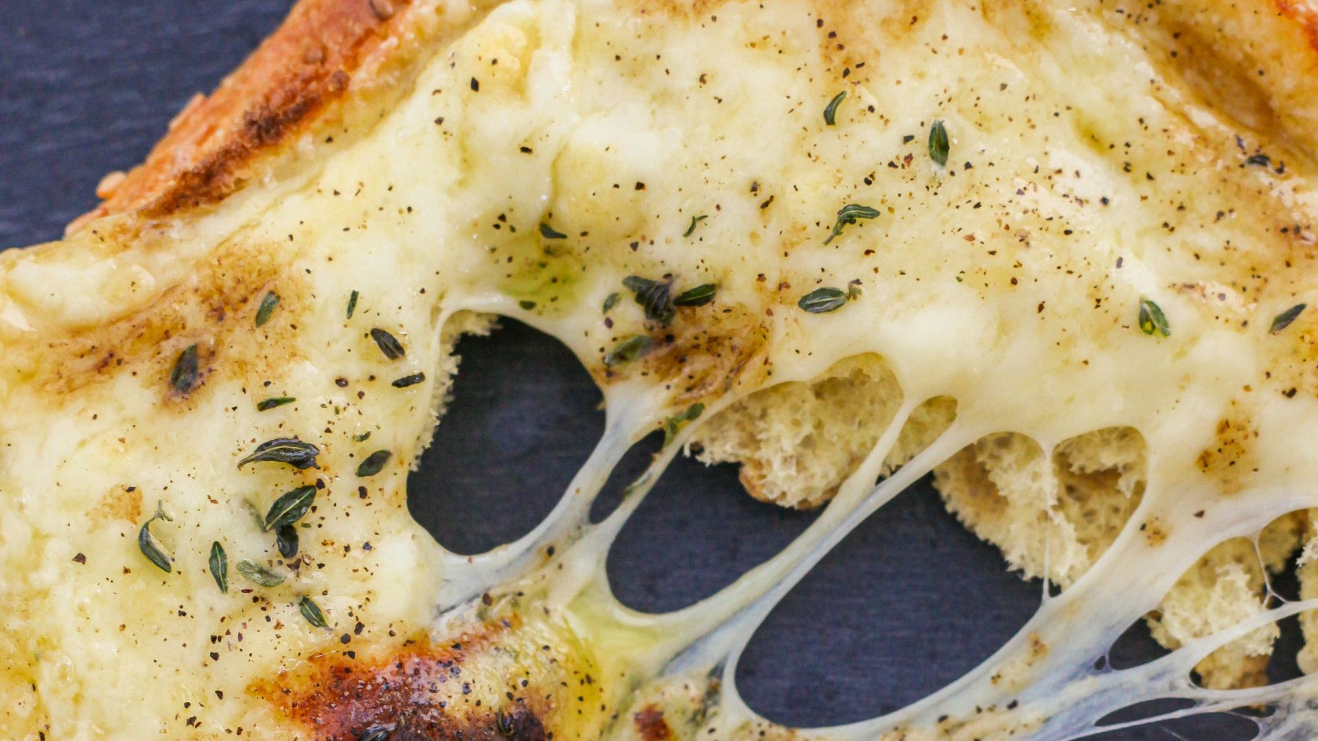 pizza with cheese and green vegetable