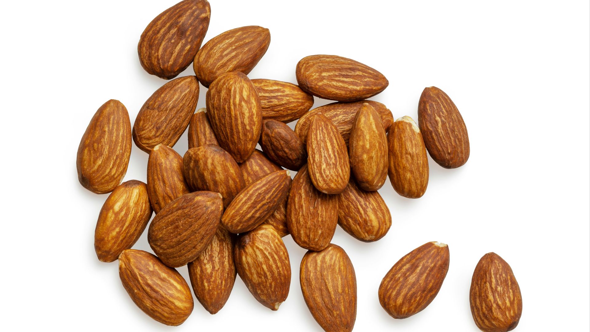 brown almond nuts on white background