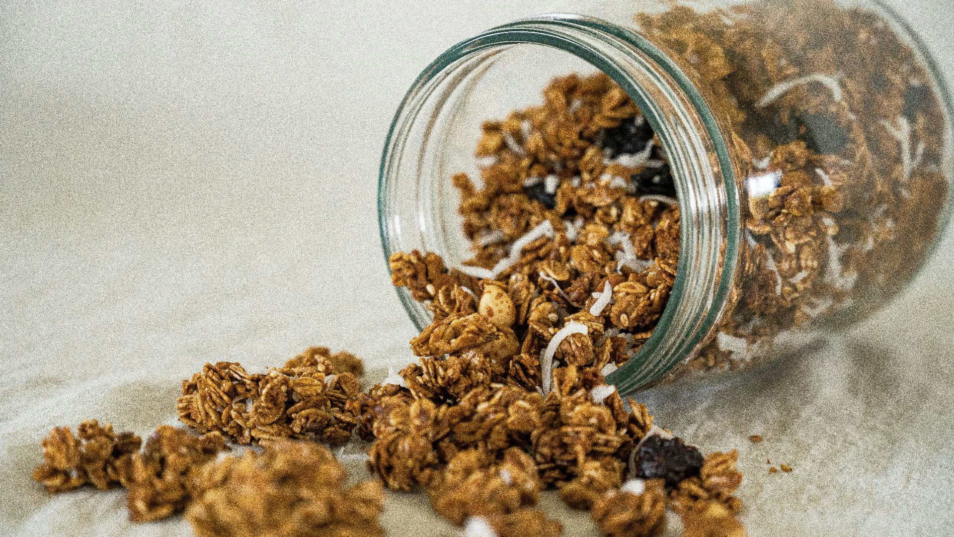 a glass bowl full of dried brown and white grains