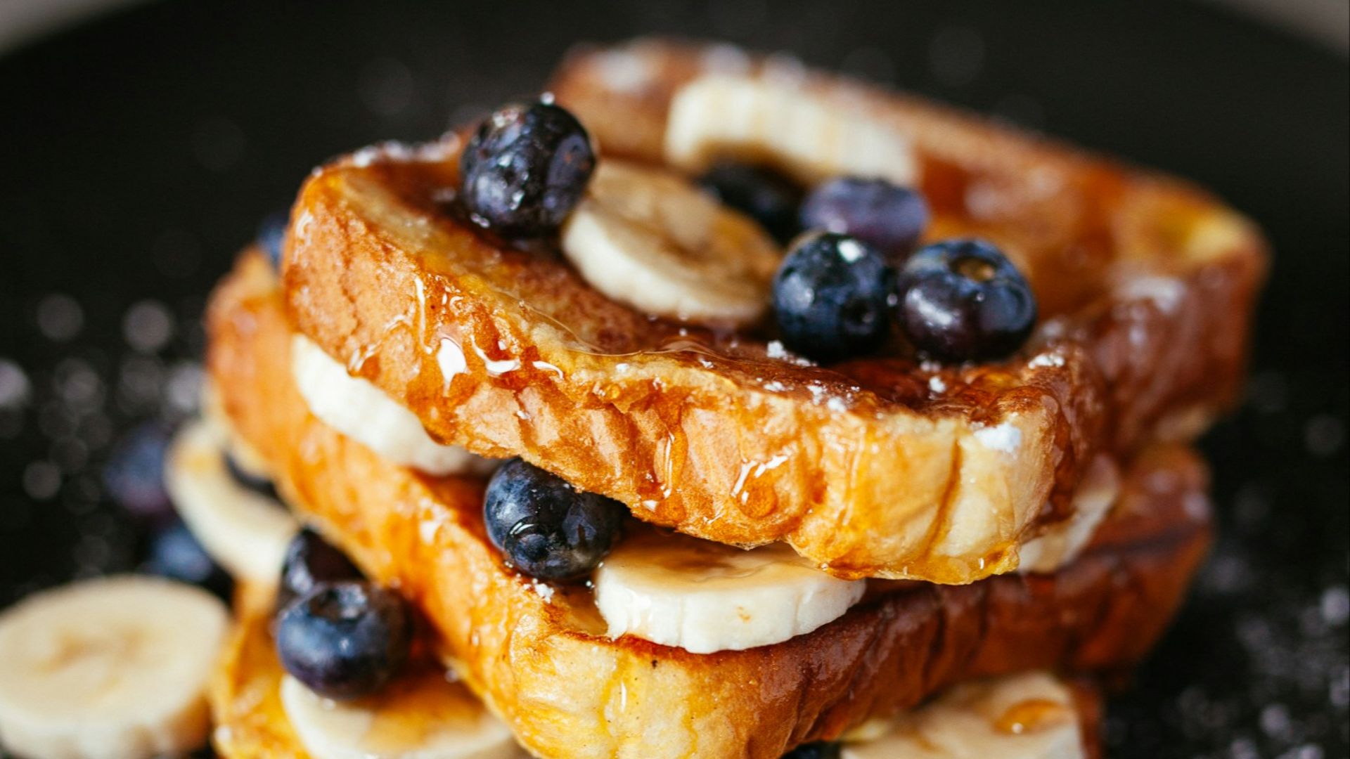 toast bread with blueberry on black plate