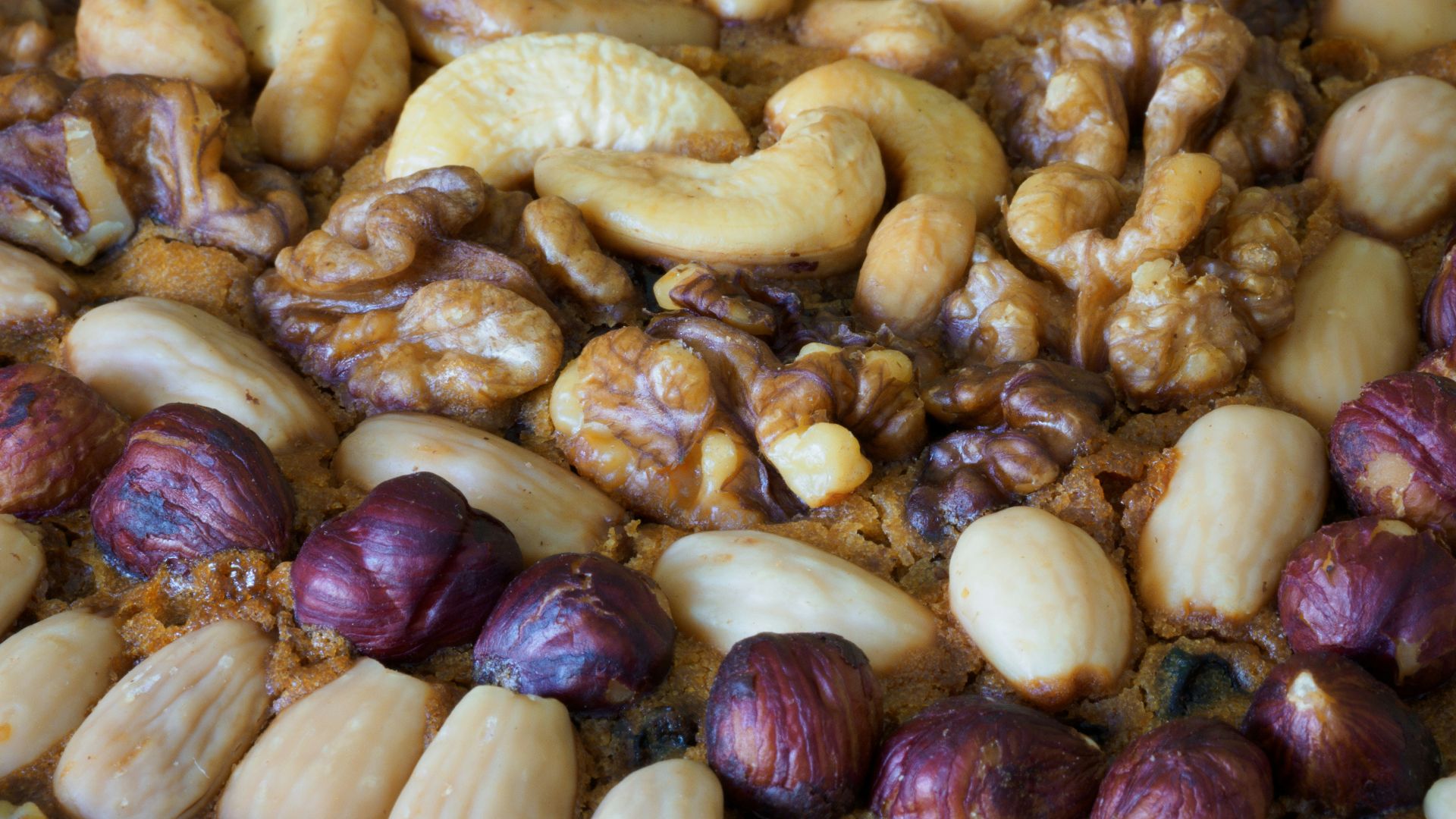 brown and beige nuts on white paper