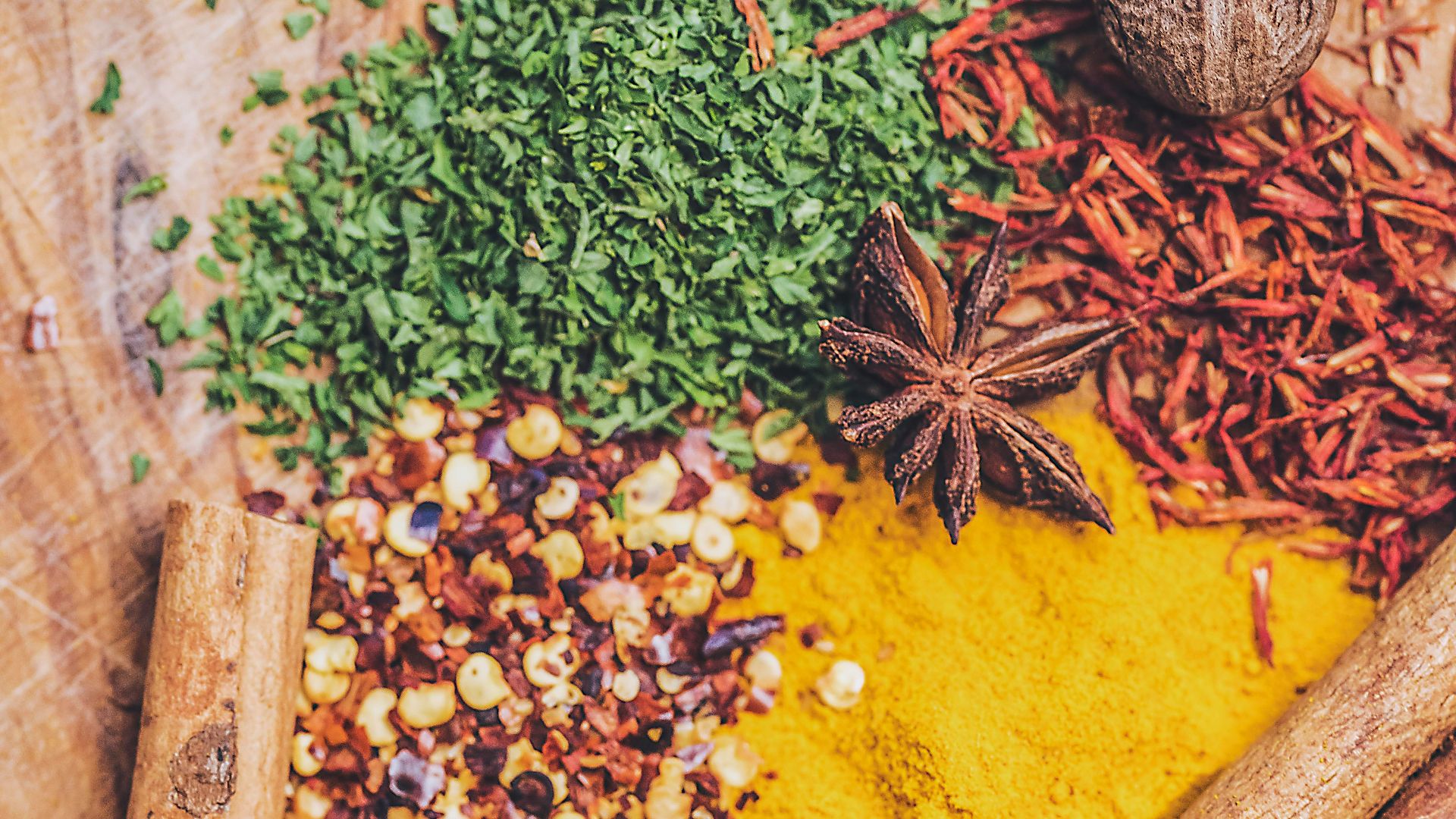 brown wooden chopping board with black beans and brown dried leaves