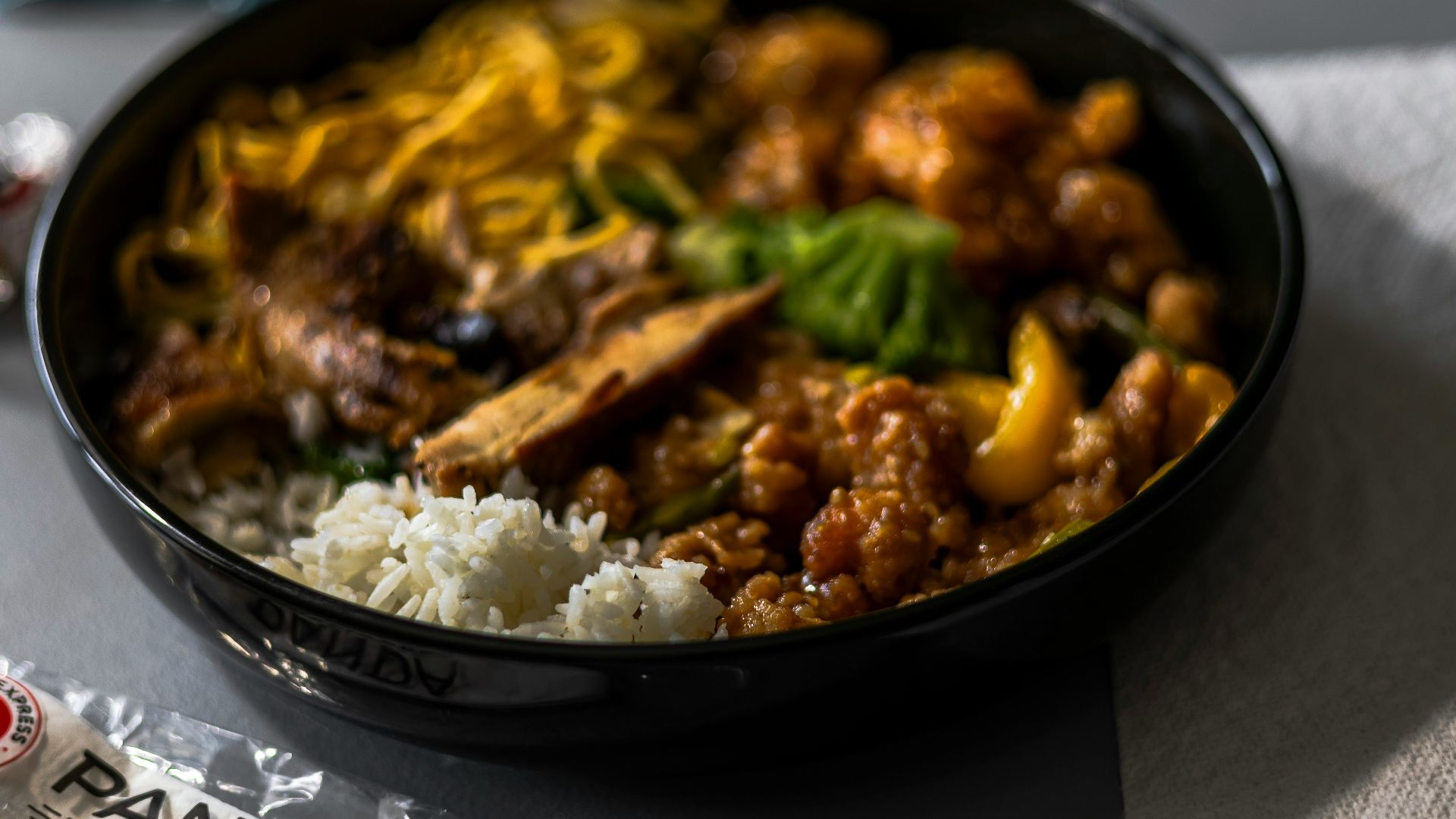 A bowl of food sitting on top of a table