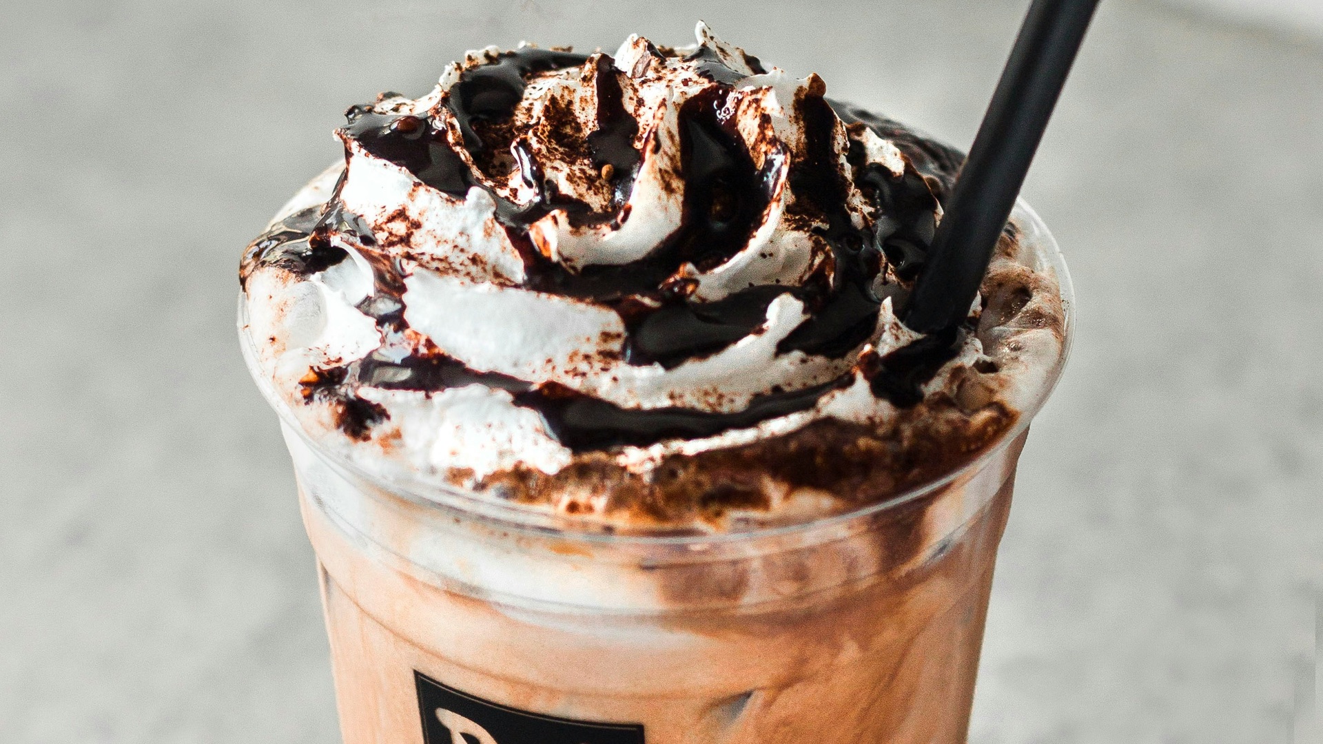 ice coffee cup on gray surface
