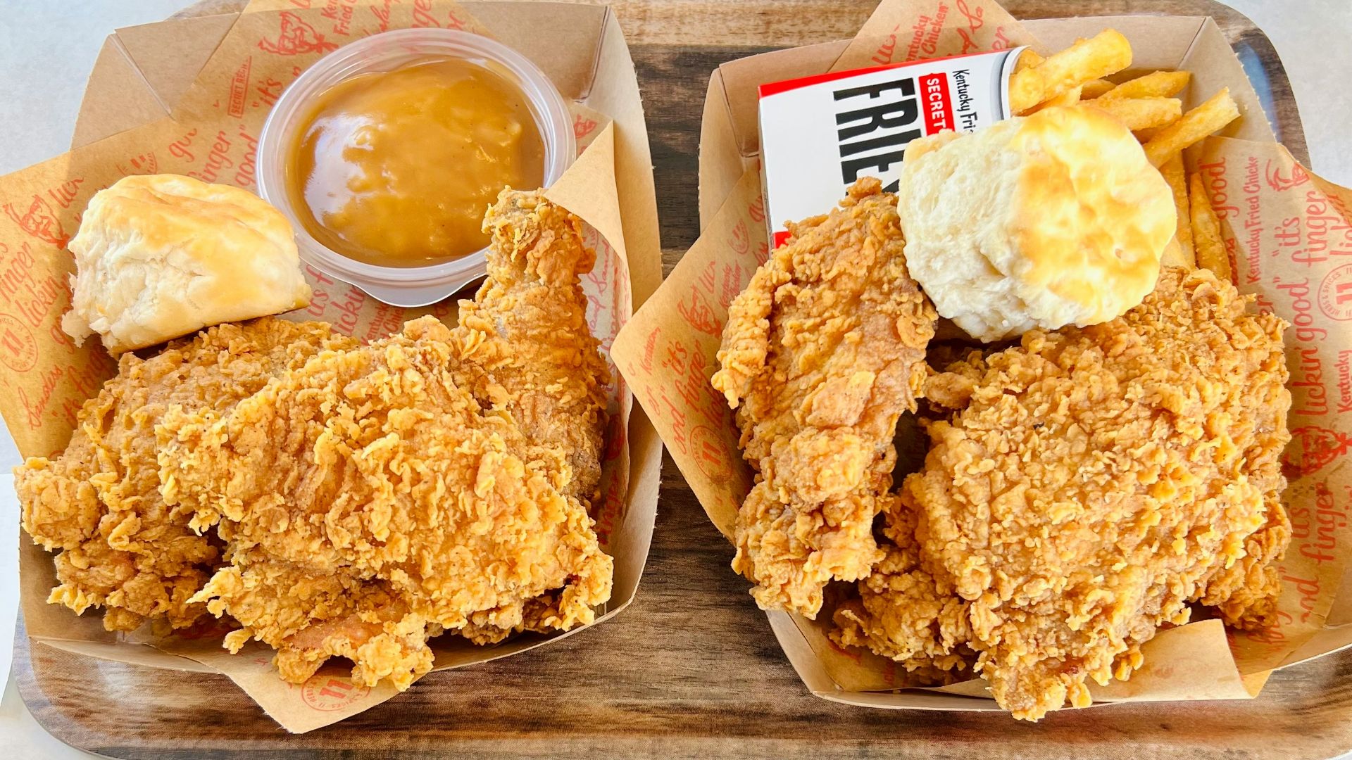a couple of trays of food on a table