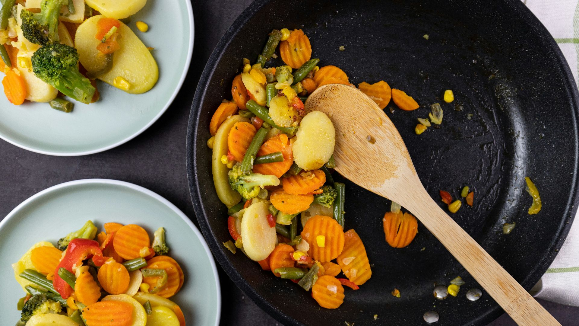 sliced vegetables on black ceramic plate
