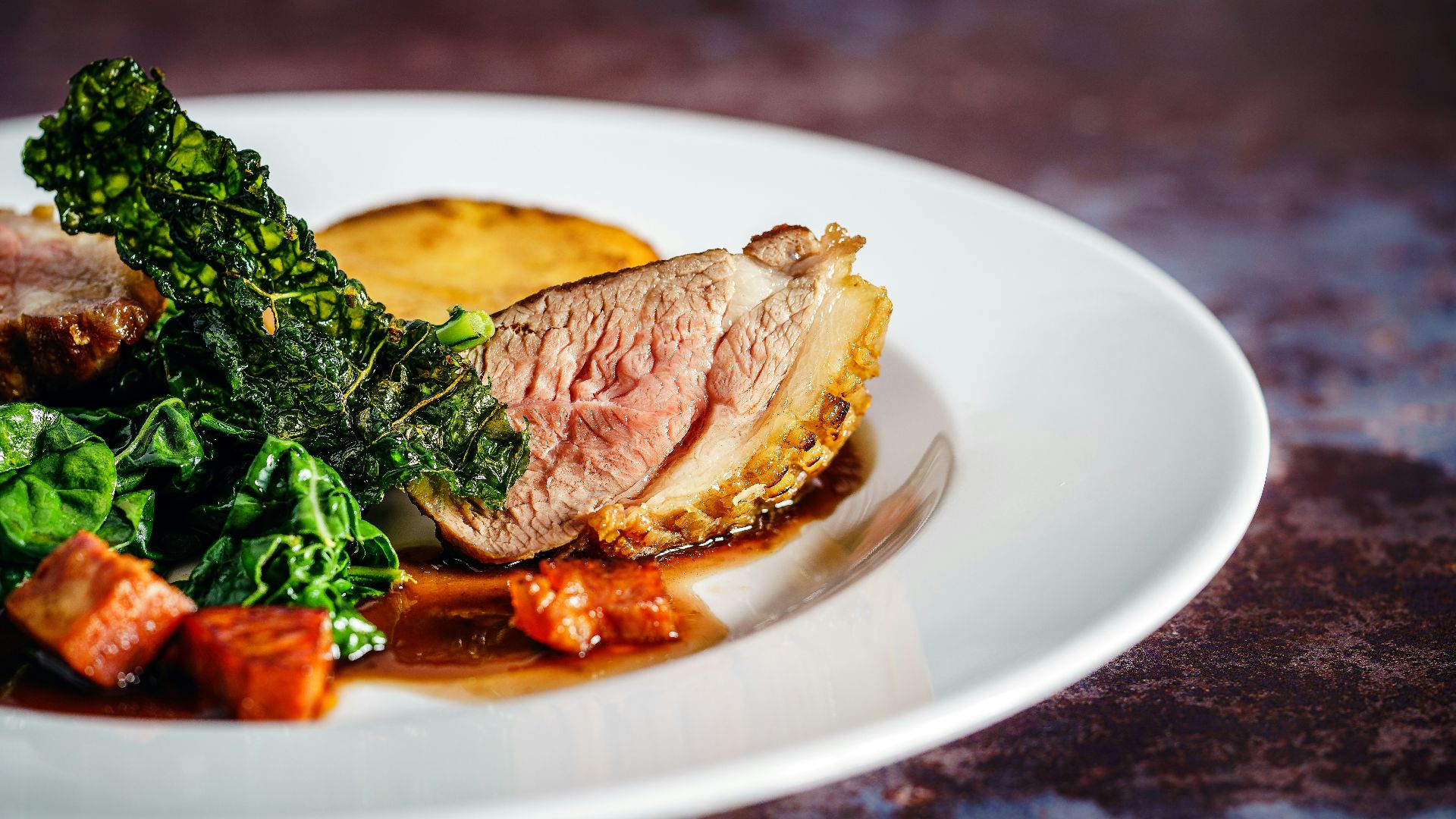 cooked meat on white ceramic plate