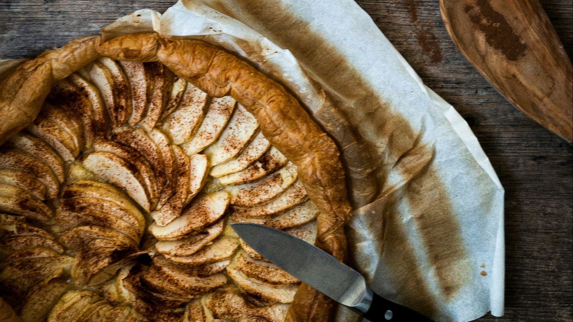 stainless steel mug with brown liquid on white textile