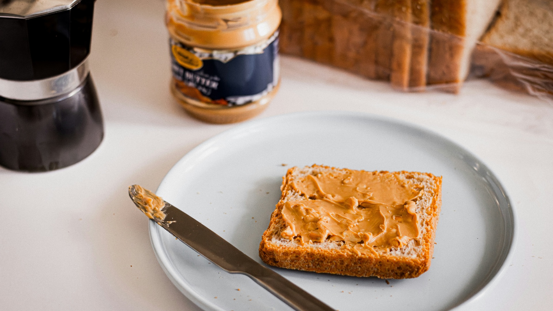 a piece of bread sitting on top of a white plate