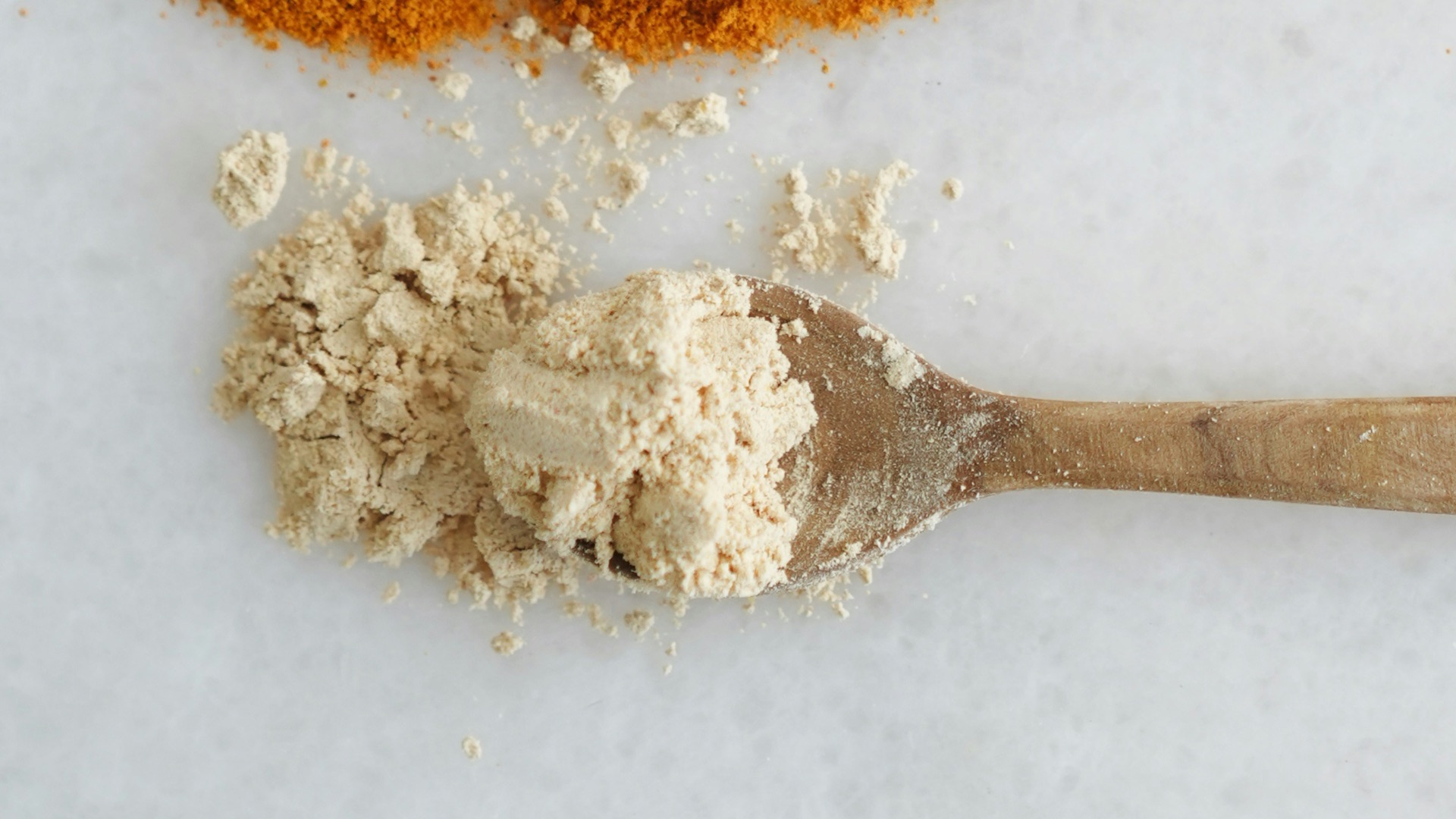 Three spoons with different types of spices on them