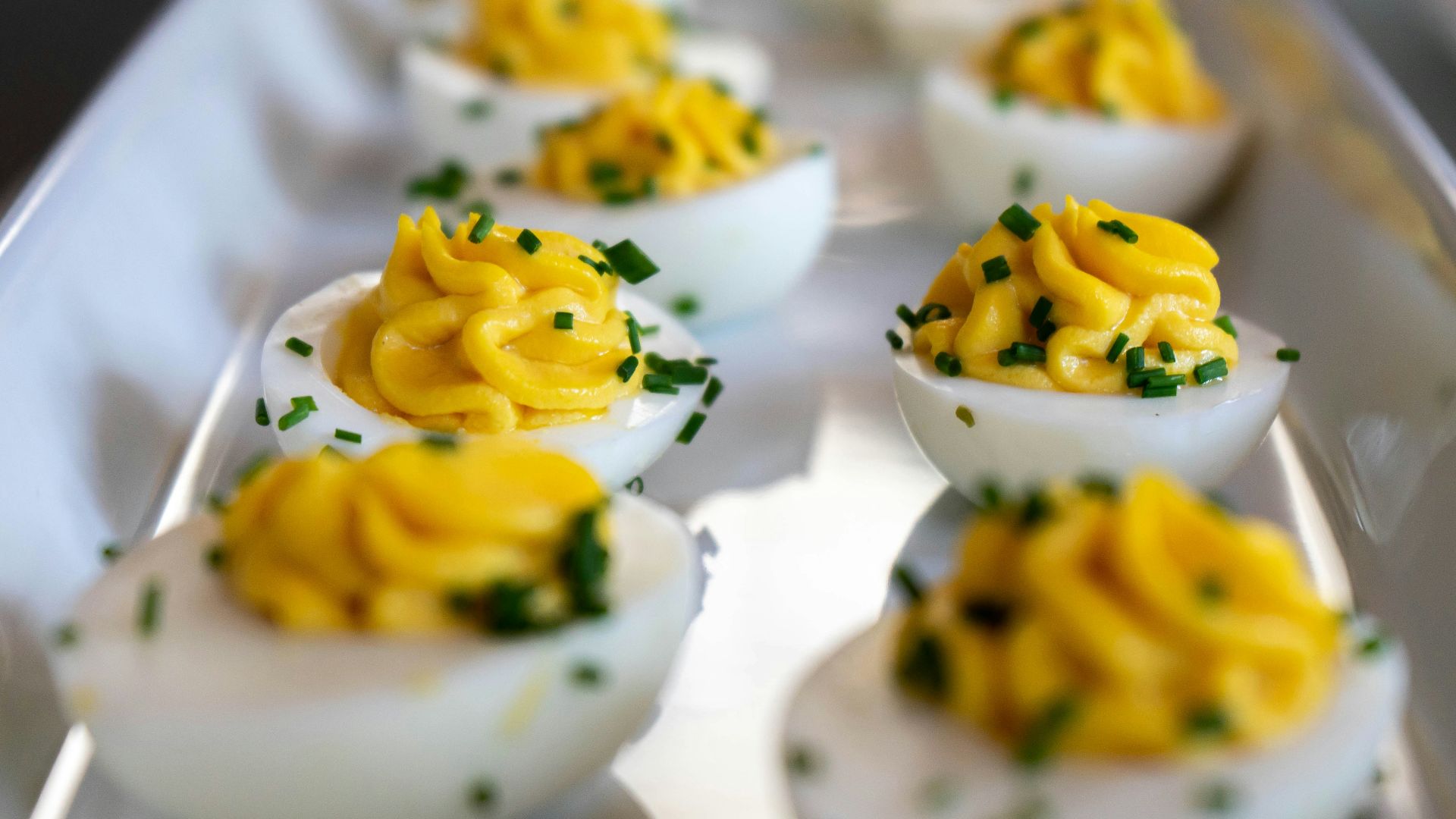 white and yellow icing covered cupcakes