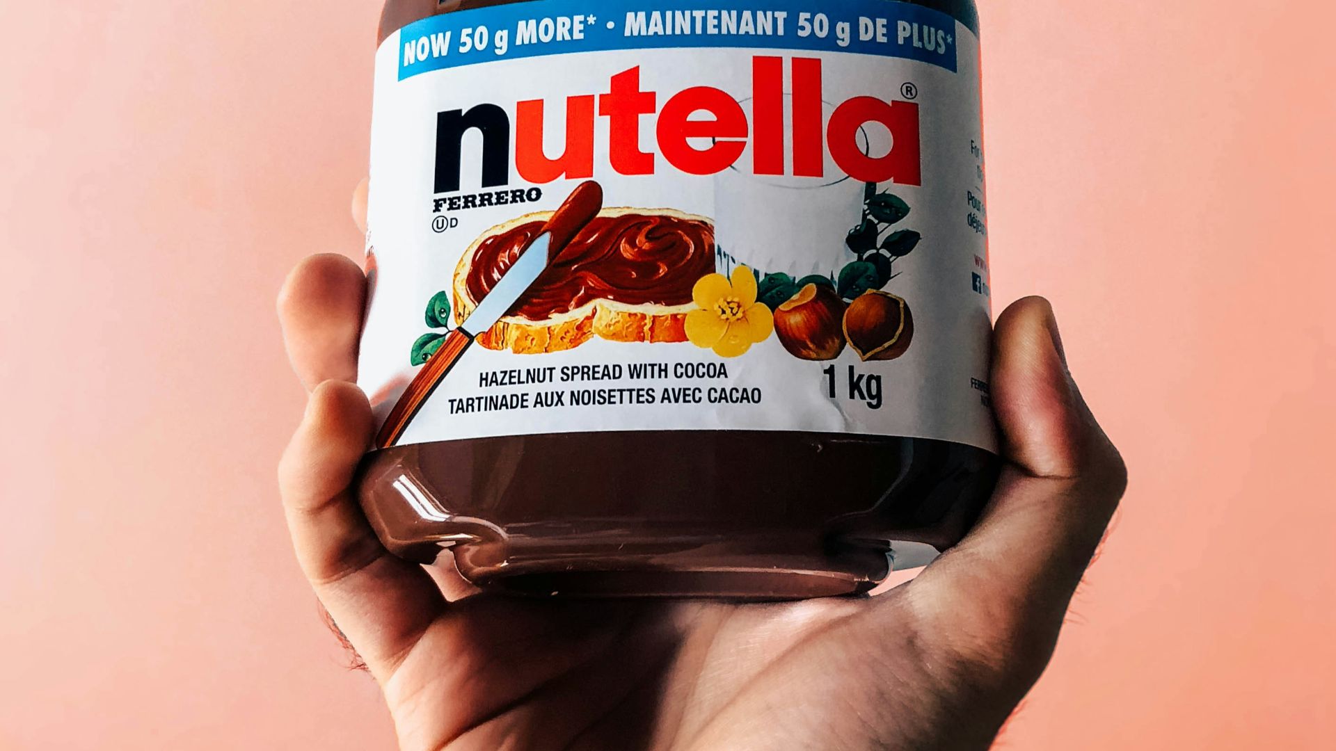 person holding Nutella jar