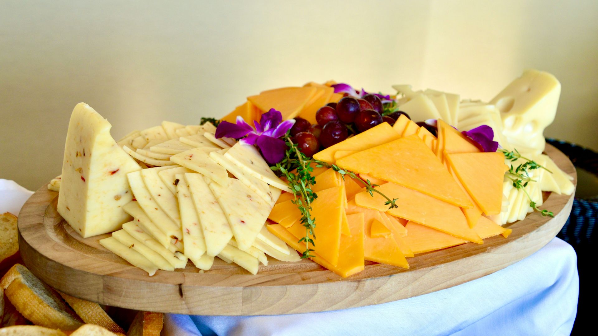 sliced cheese on brown wooden chopping board