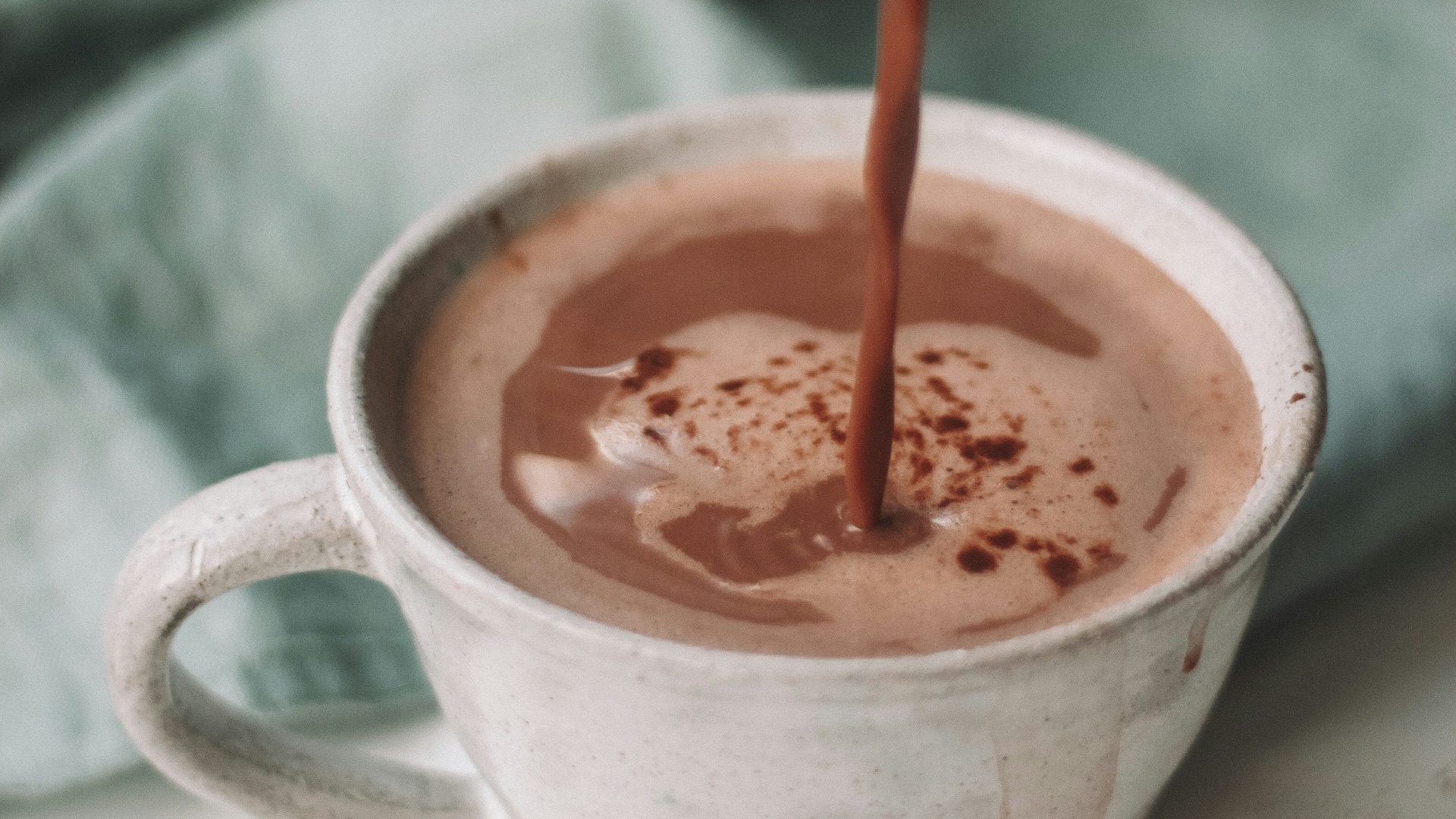 chocolate coffee pouring in white mug