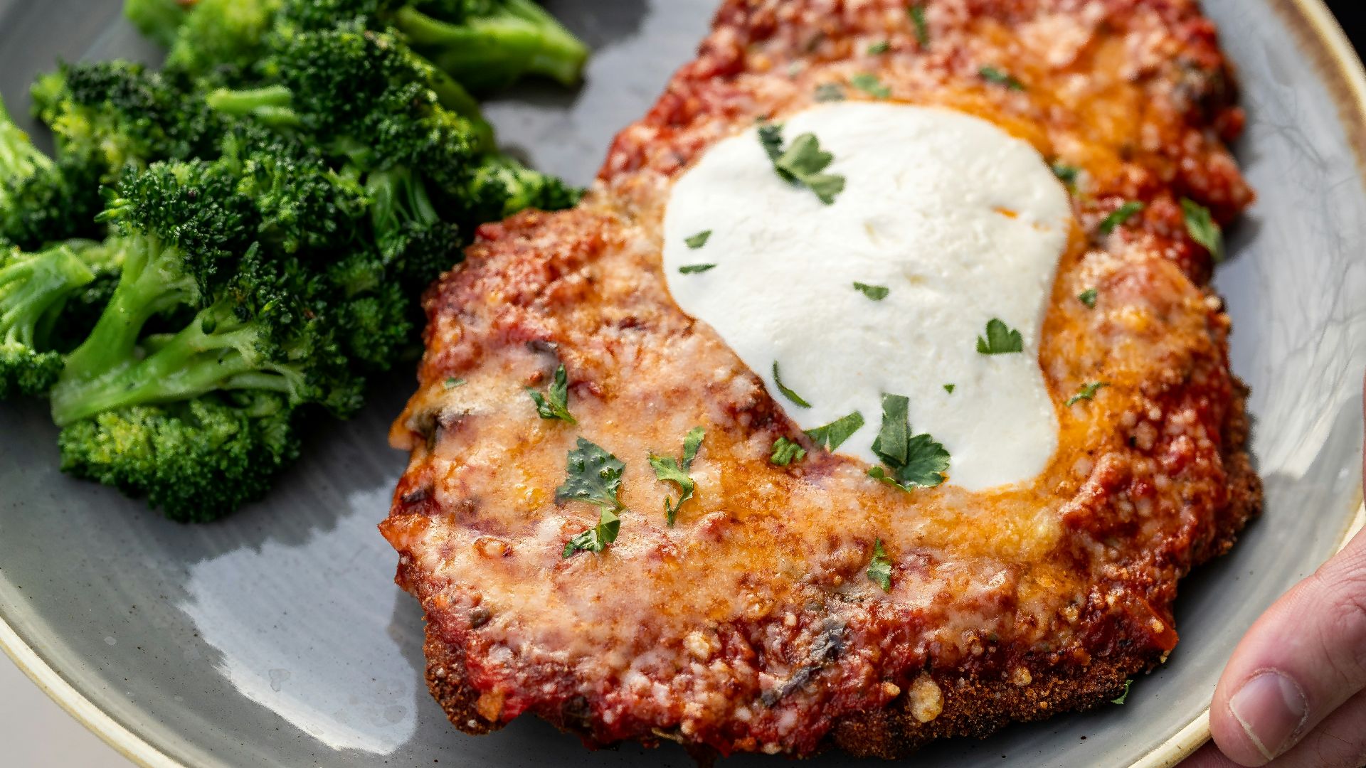 a plate of food with meat and broccoli