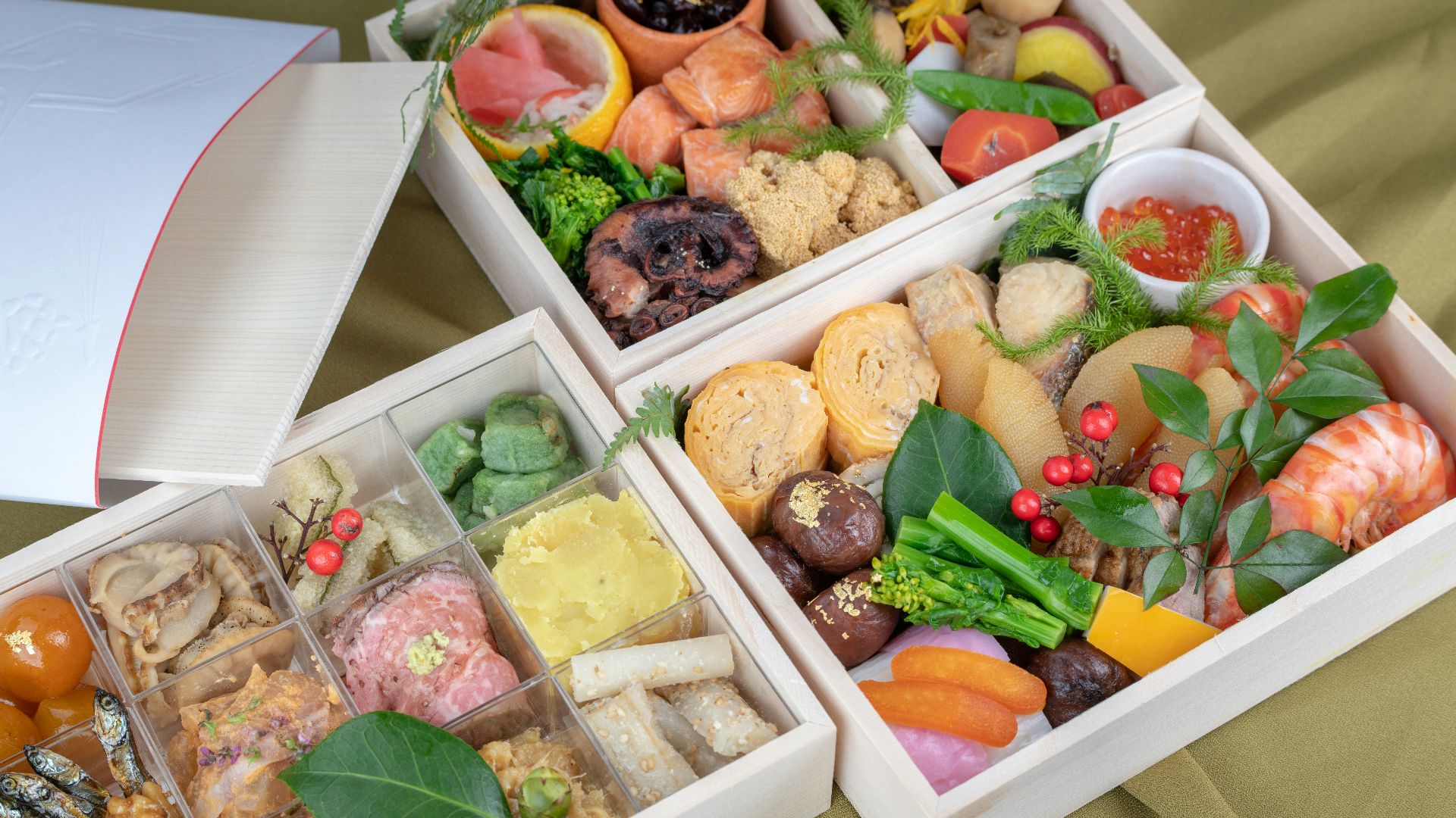 chocolates and fruits on three boxes