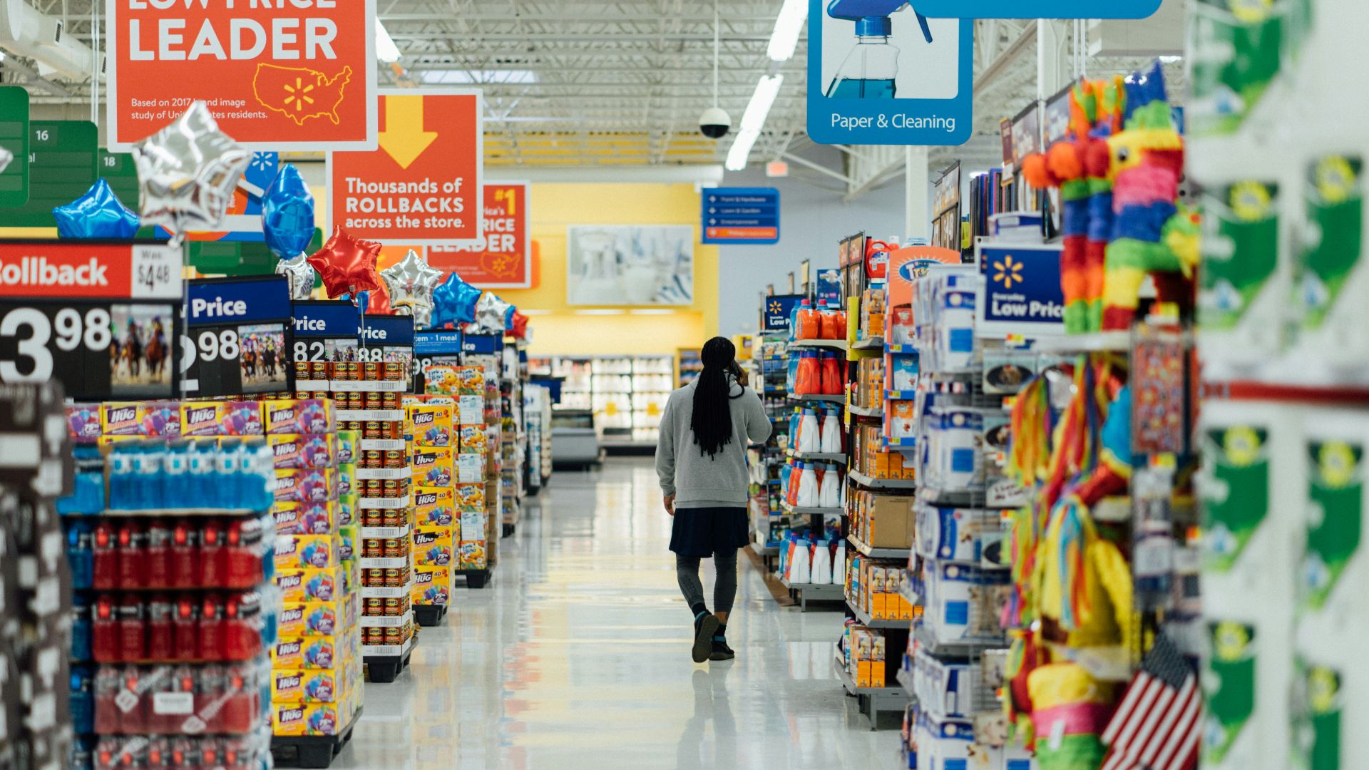 person standing between shelvings