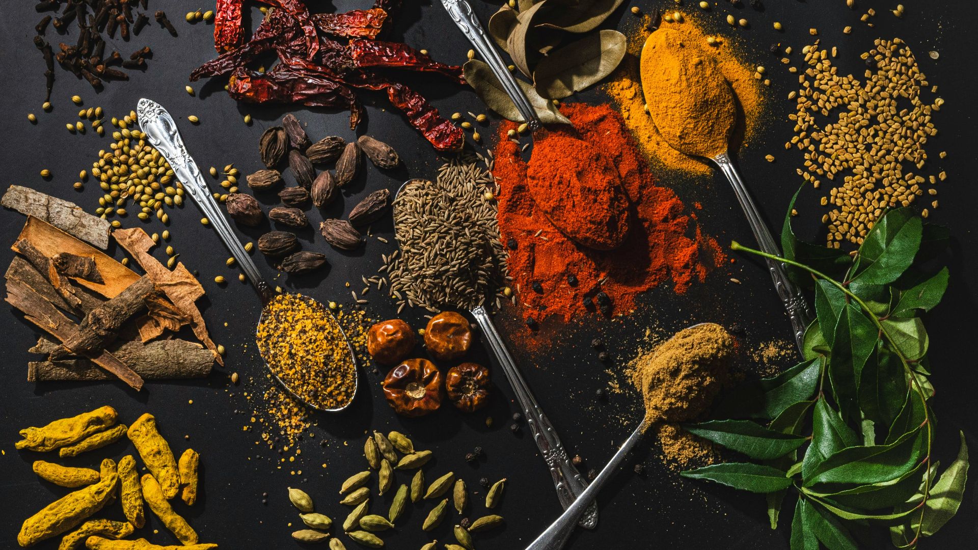 a table topped with different types of spices