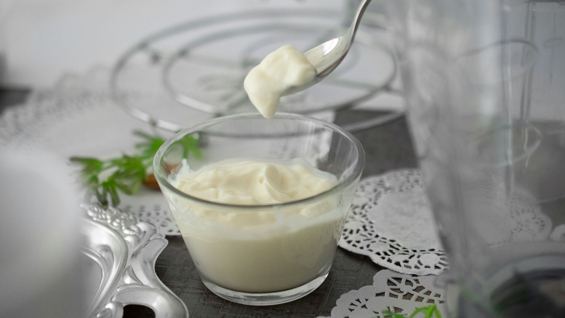 close-up photo of white cream in clear shot glass