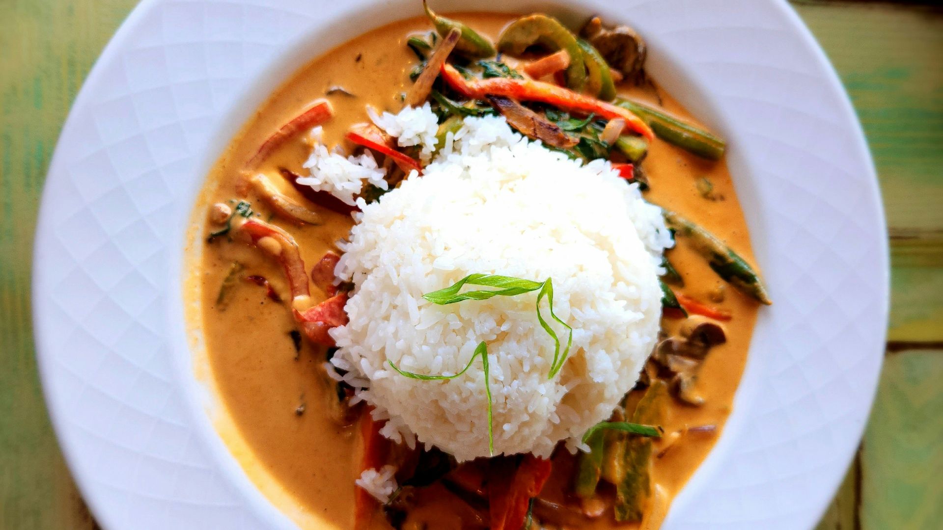 A plate of food on a wooden table