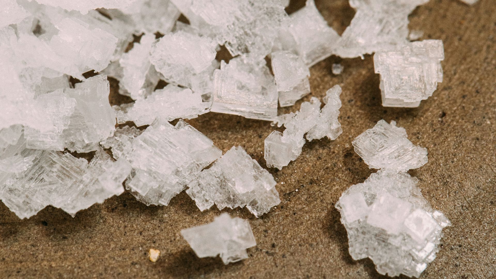 white snow on brown sand