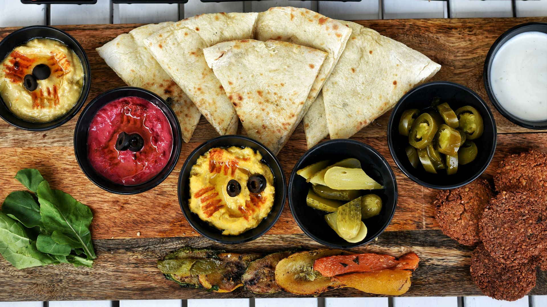 Assortment of middle eastern dips and flatbread