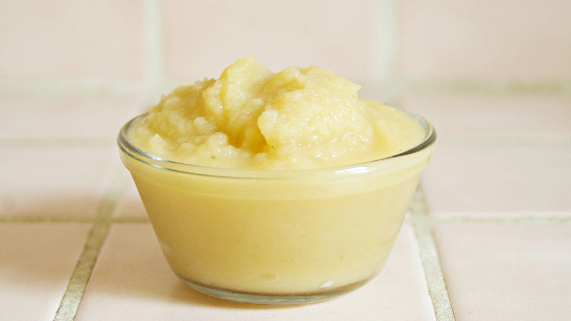 yellow cream in clear glass bowl