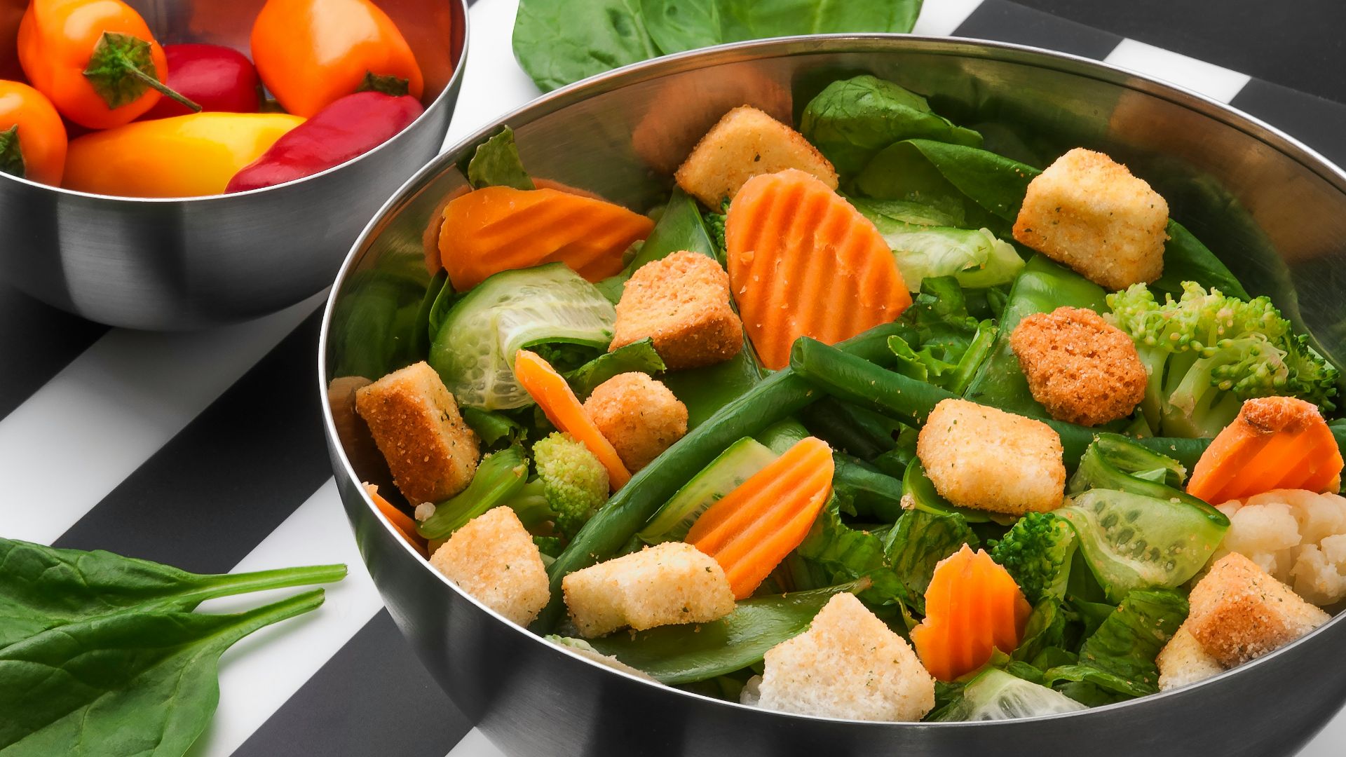 sliced vegetables on stainless steel bowl