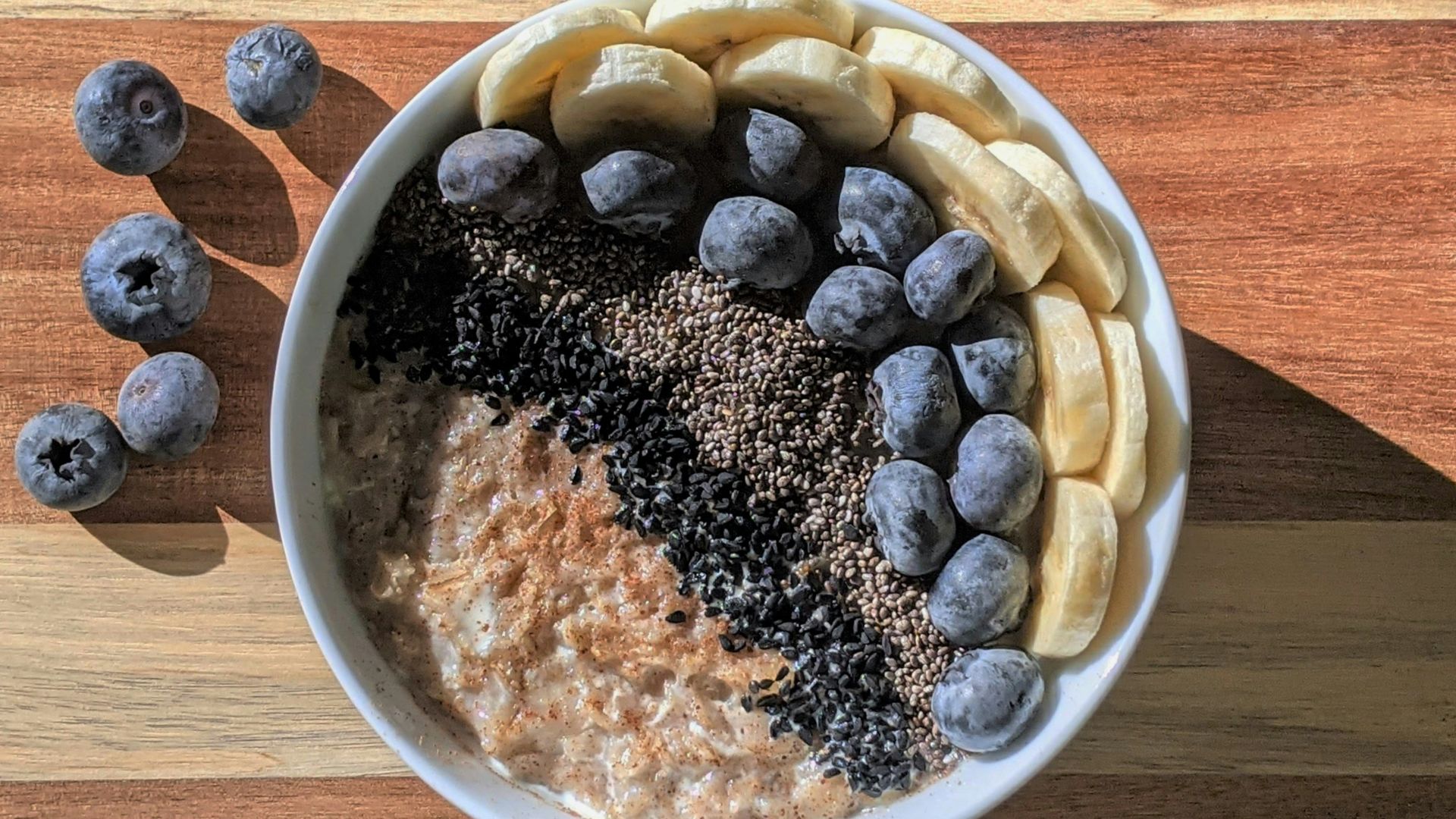 brown and black beans in white ceramic bowl