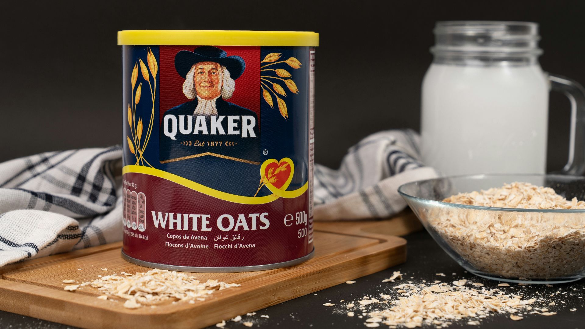 A can of oats next to a bowl of oats