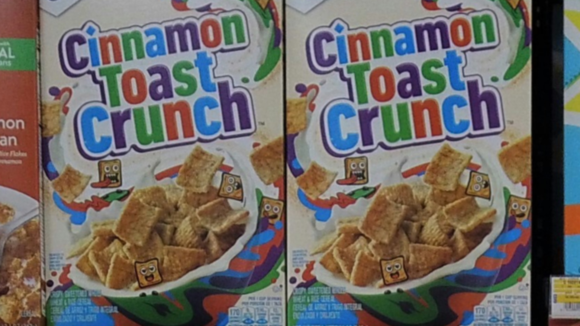 a shelf of cereal boxes