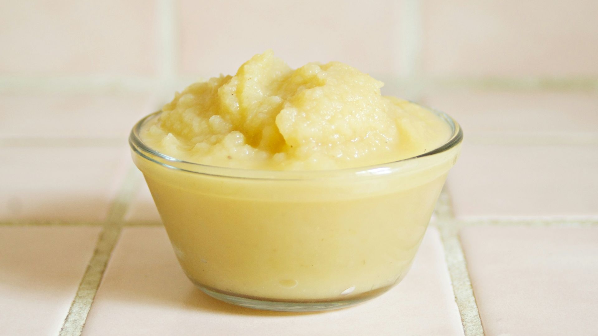 yellow cream in clear glass bowl