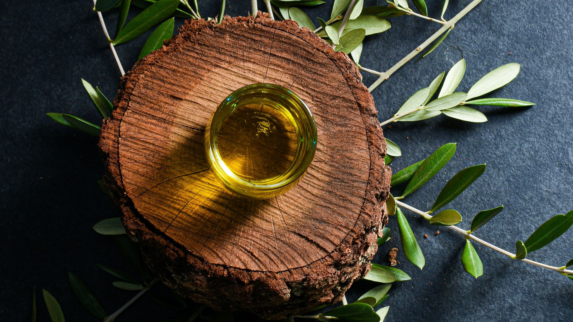 brown round wooden ornament on green leaves