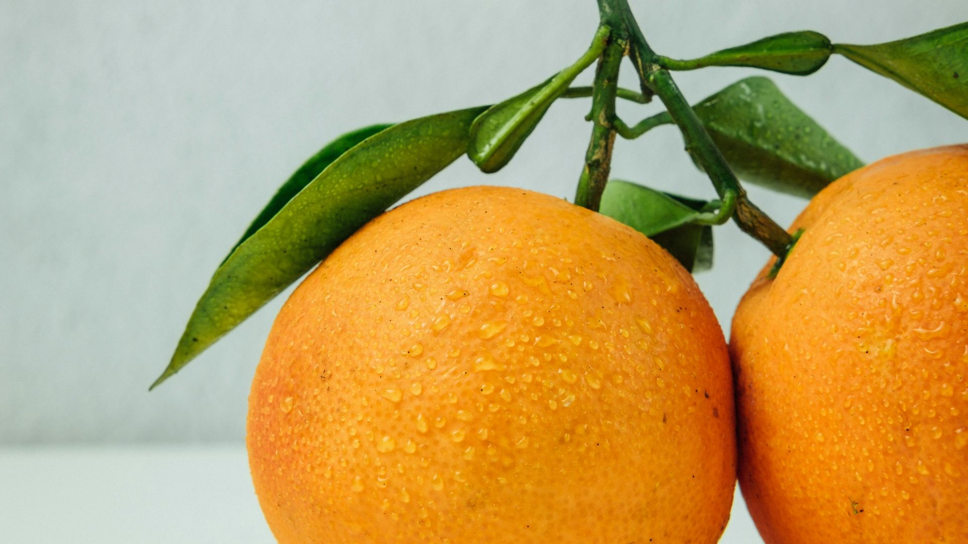 two orange fruits on table