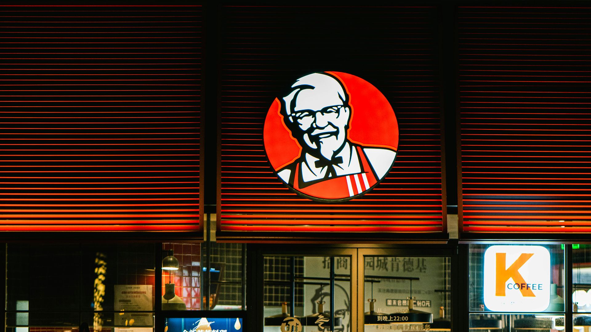 a store front with a lit up sign above it